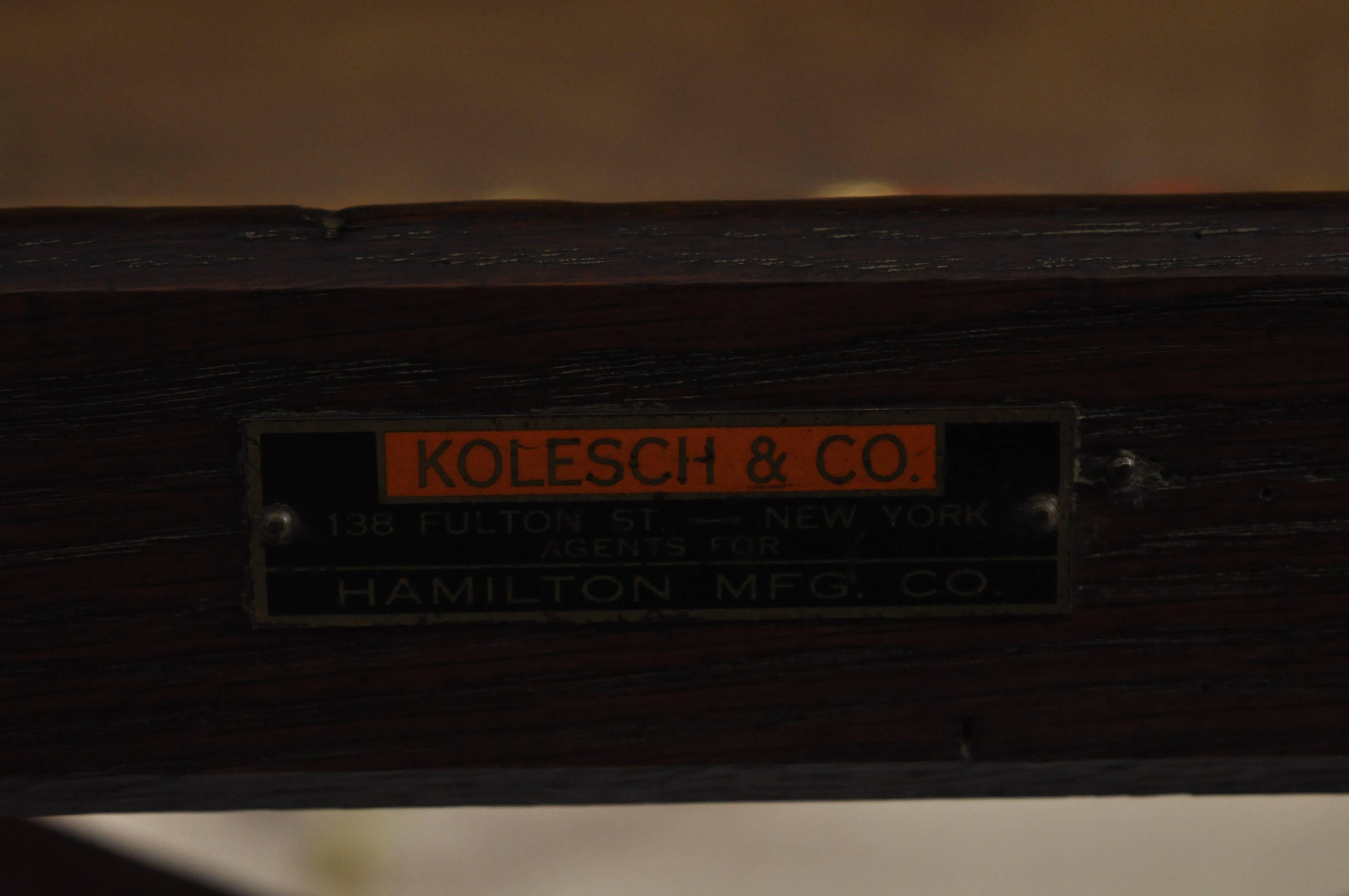 Item: Antique Kolesch & Co Hamilton Mfg oakwood, and cast iron drafting table

Details: Solid wood construction, fully adjustable, cast iron supports, original label

Age: Early 20th century.

Measurements: 

Work surface 48