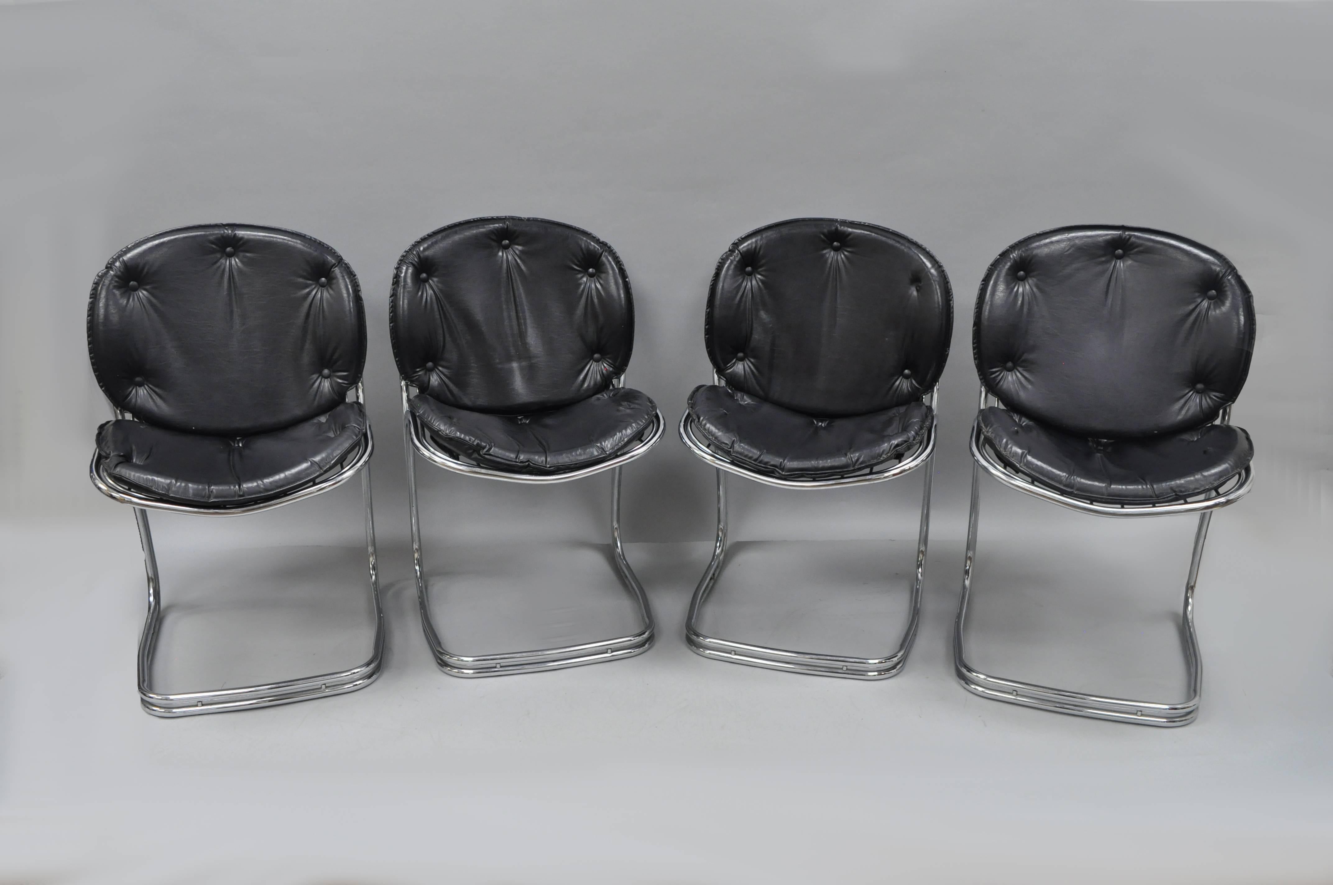 Set of four vintage midcentury Italian Modern chrome and black vinyl dining chairs attributed to Gastone Rinaldi for RIMA. Set features sleek sculptural form, wire chrome frames, button tufted black vinyl cushions, and clean Modernist line.