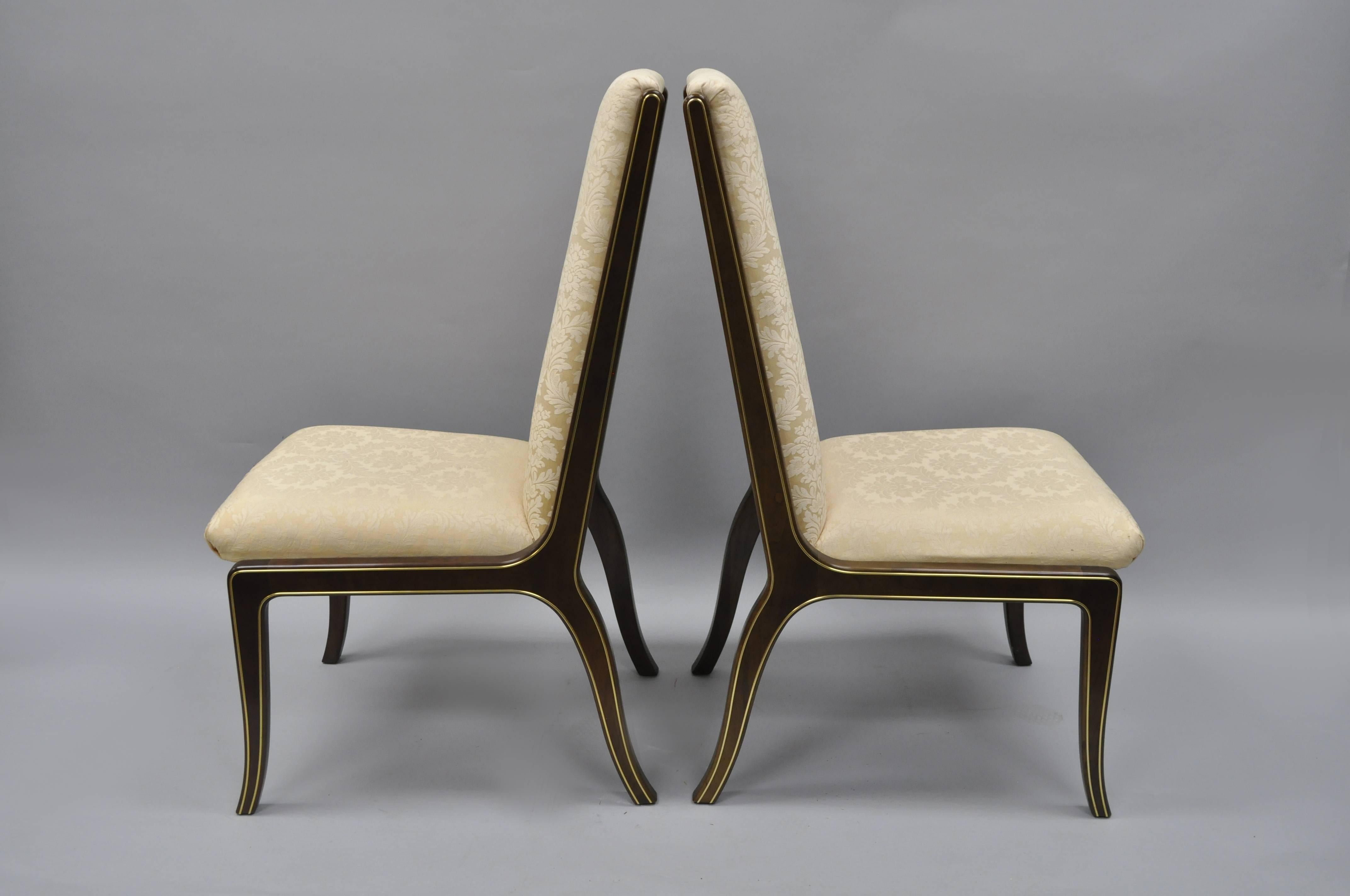 High Quality Pair of Mastercraft for Baker Furniture Co. Dining Side Chairs Designed by William Doezema. Chairs feature sculptural solid wood frames with brass inlaid trim throughout and upholstered seats and backs. This clean lined design provides