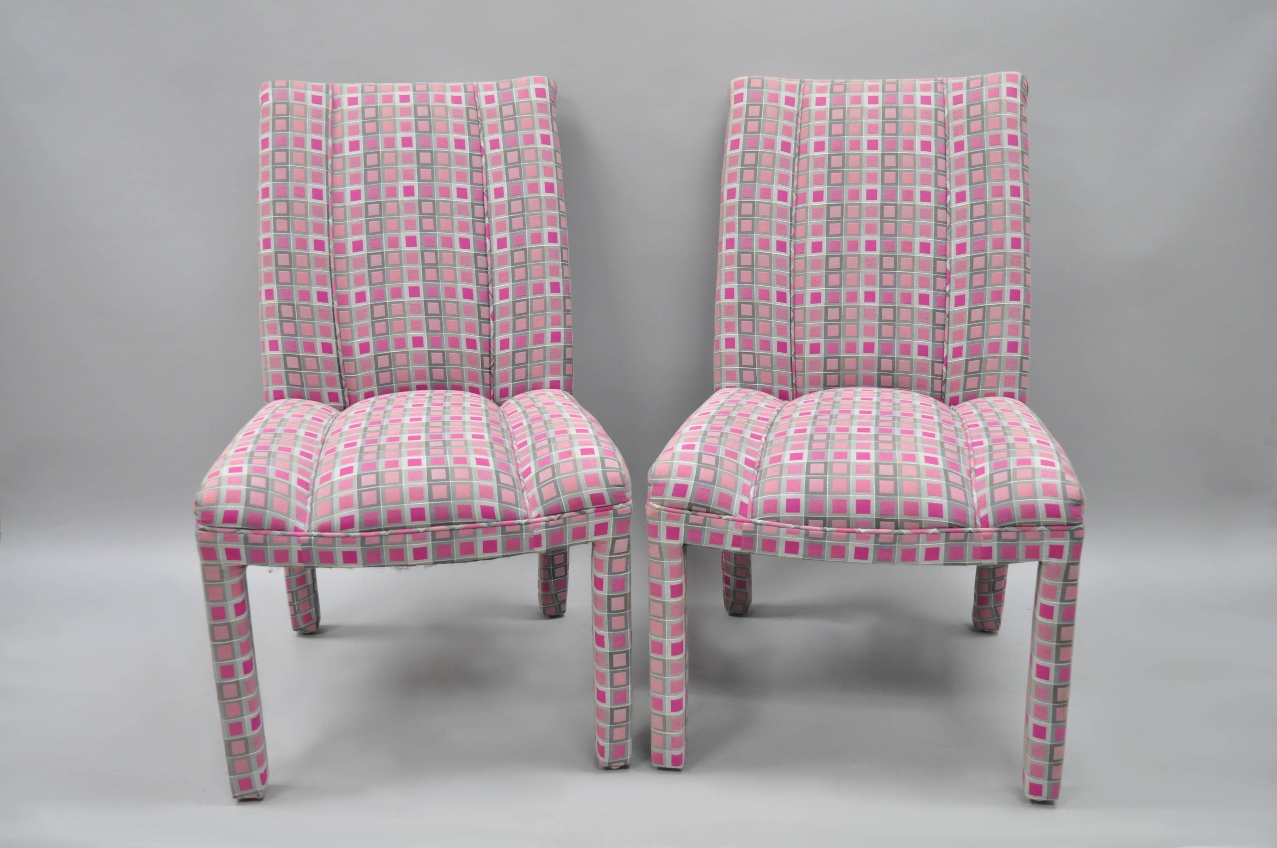 Set of six pink and sliver fully upholstered Parsons style dining chairs in the Hollywood Regency style. Chairs feature clean modernist lines, fully upholstered frames, pink and silver geometric pattern fabric, nice wide triple seats, rolled backs,