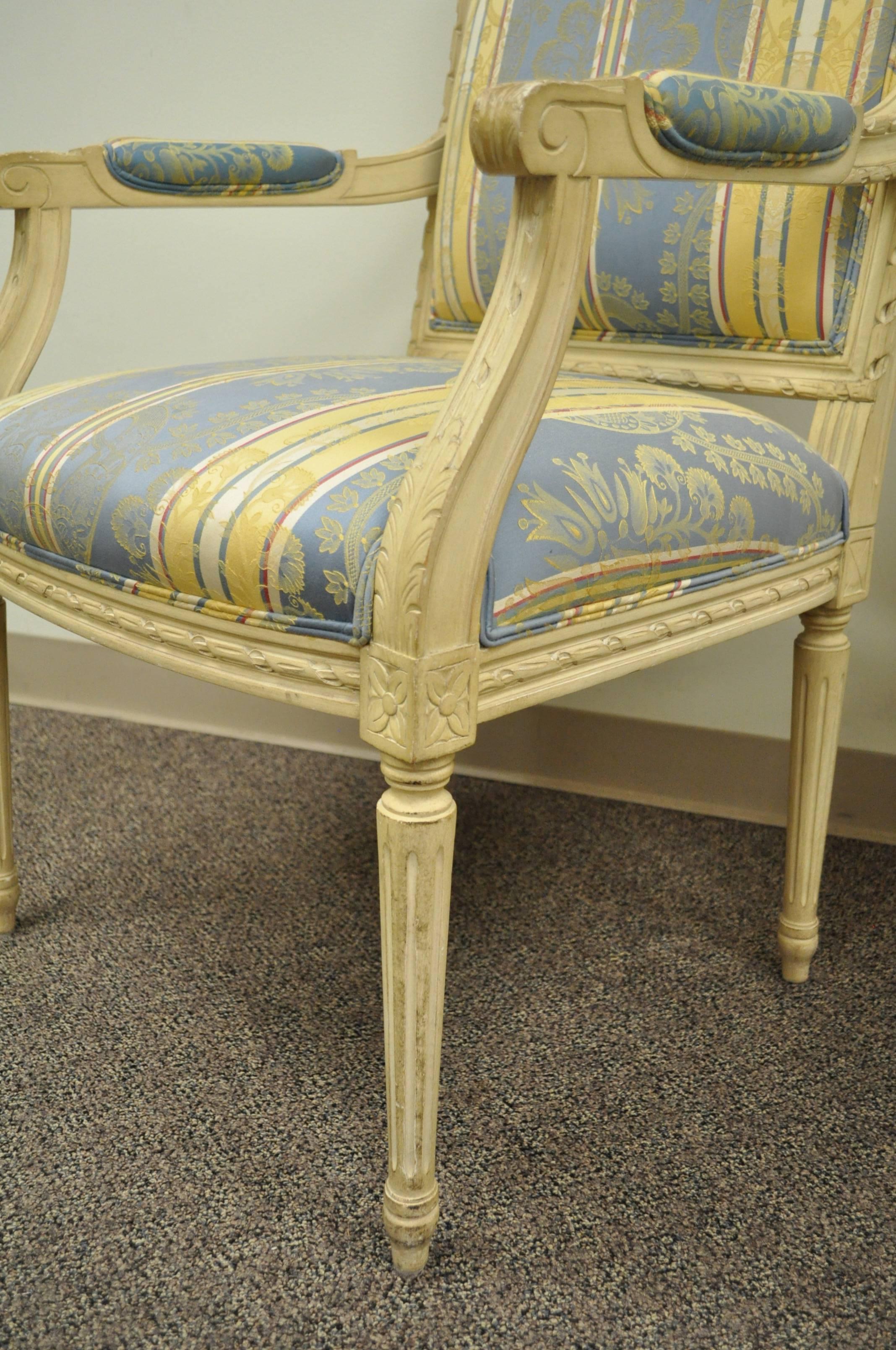 Pair of French Louis XVI Style Carved Cream Painted Fauteuil Dining Arm Chairs A In Good Condition In Philadelphia, PA