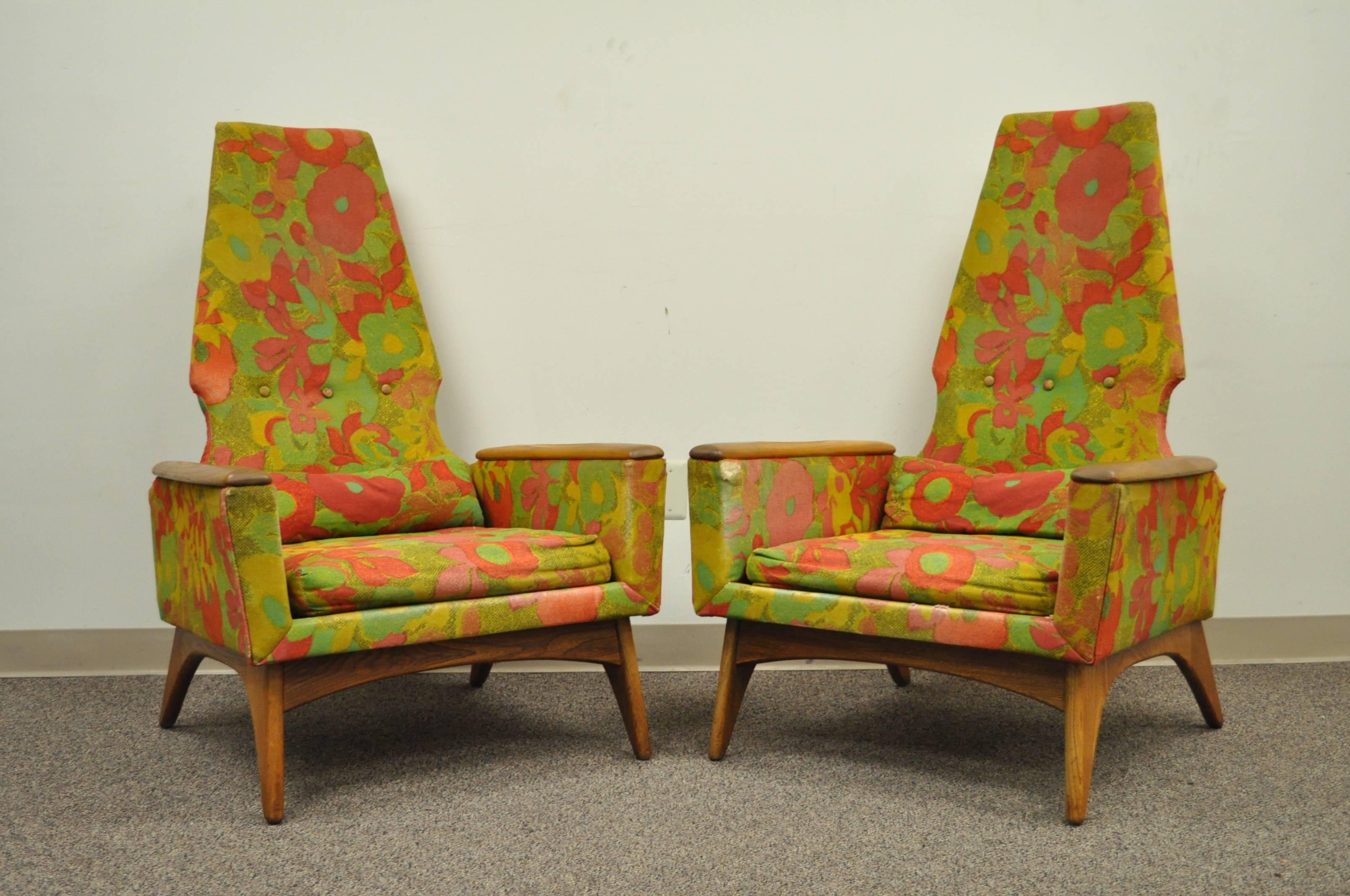Pair of vintage Mid-Century Modern sculptural tall back lounge chairs with single ottoman in the manner of Adrian Pearsall. Chairs feature tall diamond backs, solid walnut frames, tapered and angled legs, solid walnut armrests with contoured central