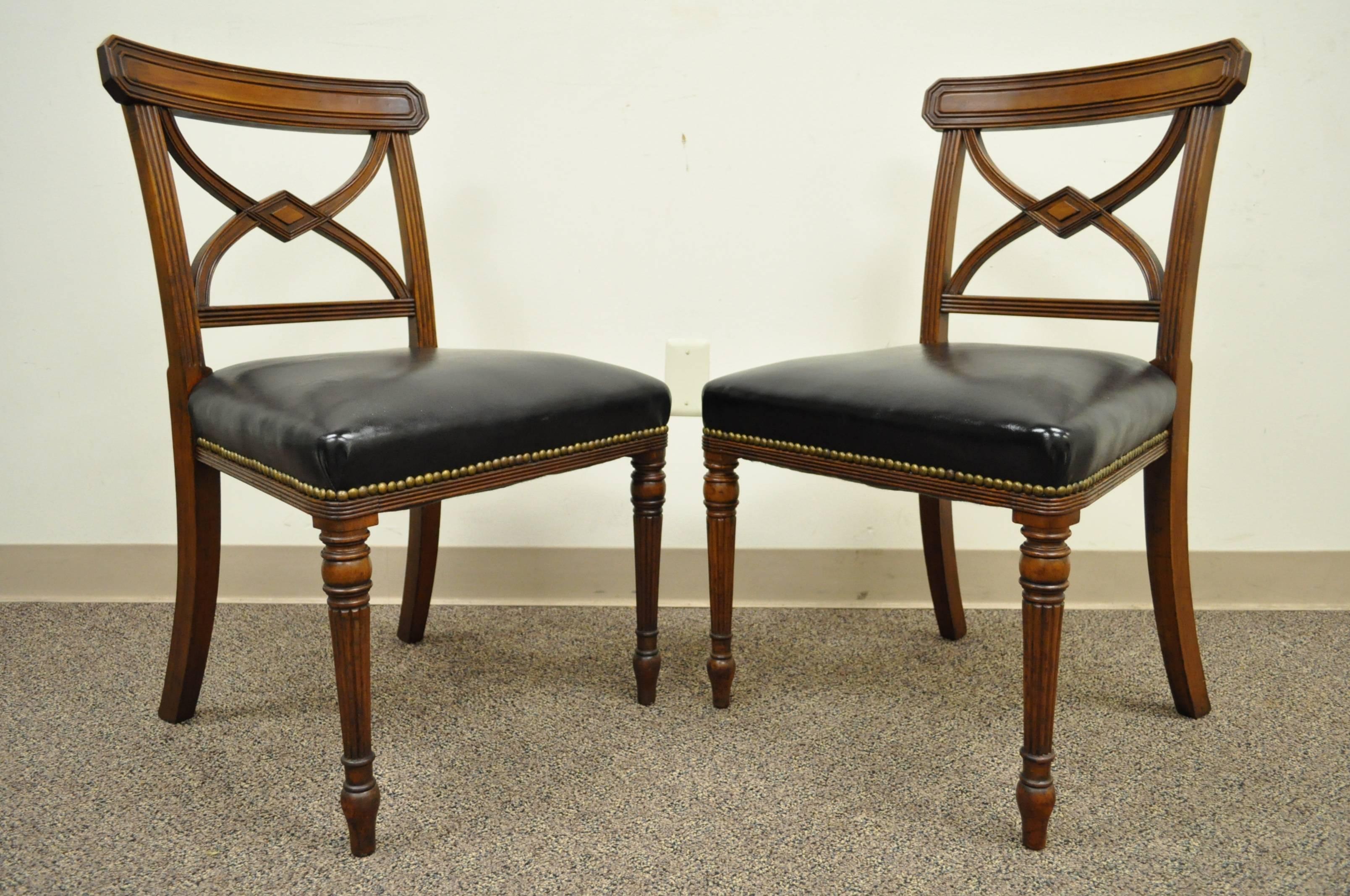 Attractive set of six English solid mahogany Regency side chairs with leather seats. It appears that three of the chairs are 19th century Regency chairs with the remaining three chairs being an early 20th century bench made custom to match. Great