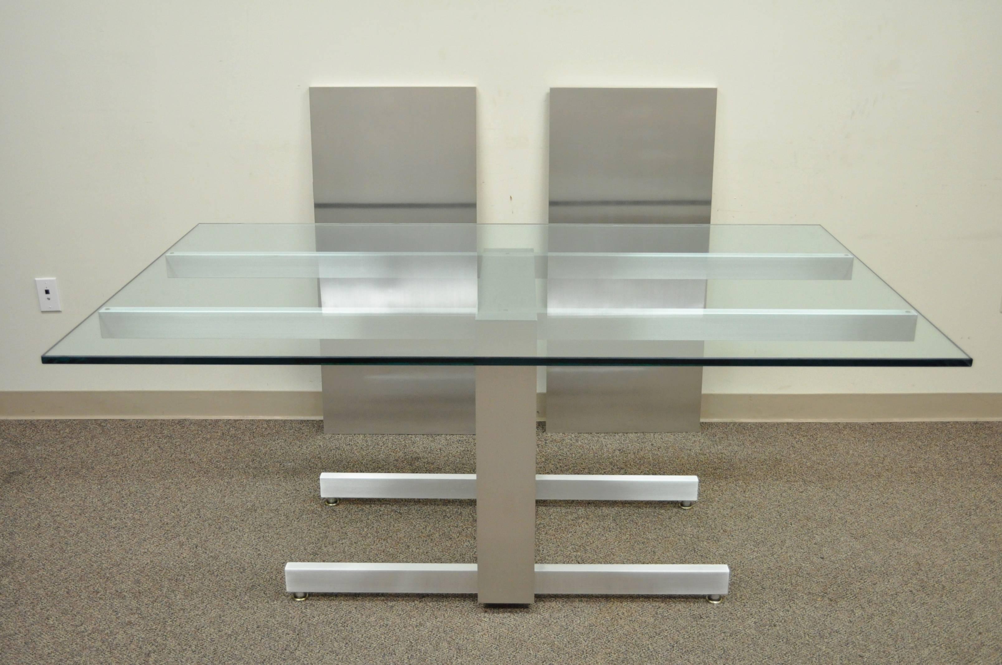 Breathtaking 1960s, Mid-Century Modern, Vladimir Kagan dining table with two leaves. Item features a brilliant brushed aluminum pedestal base with pull out supports for the two brushed aluminum 20