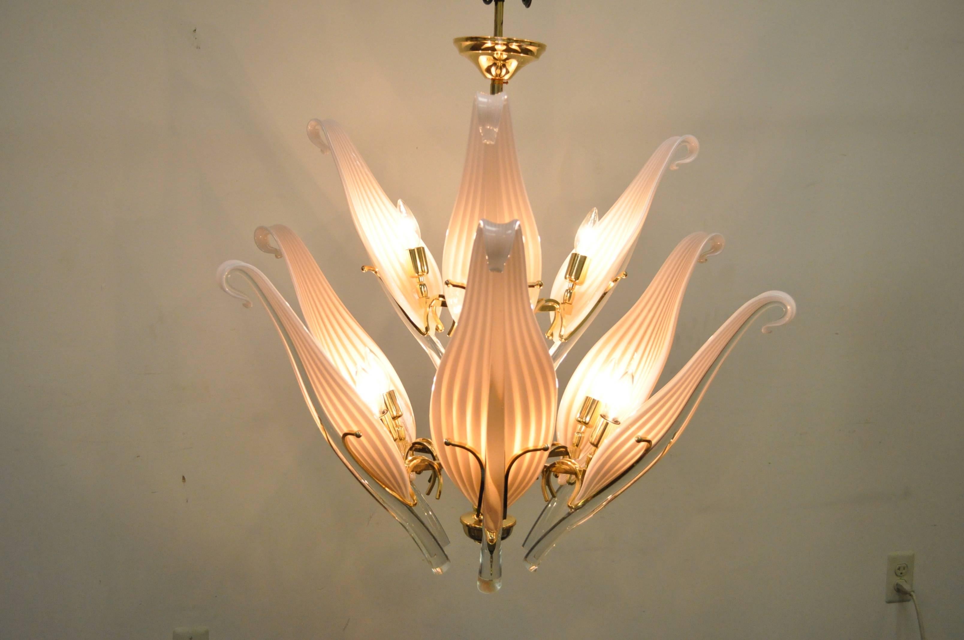Beautiful Mid-Century Modern/Hollywood Regency Handblown glass two-tier chandelier by Seguso for Murano in a pinkish peach color. Fixture features nine cattail glass leaves which set in a brass frame. Leaves are Approx 20