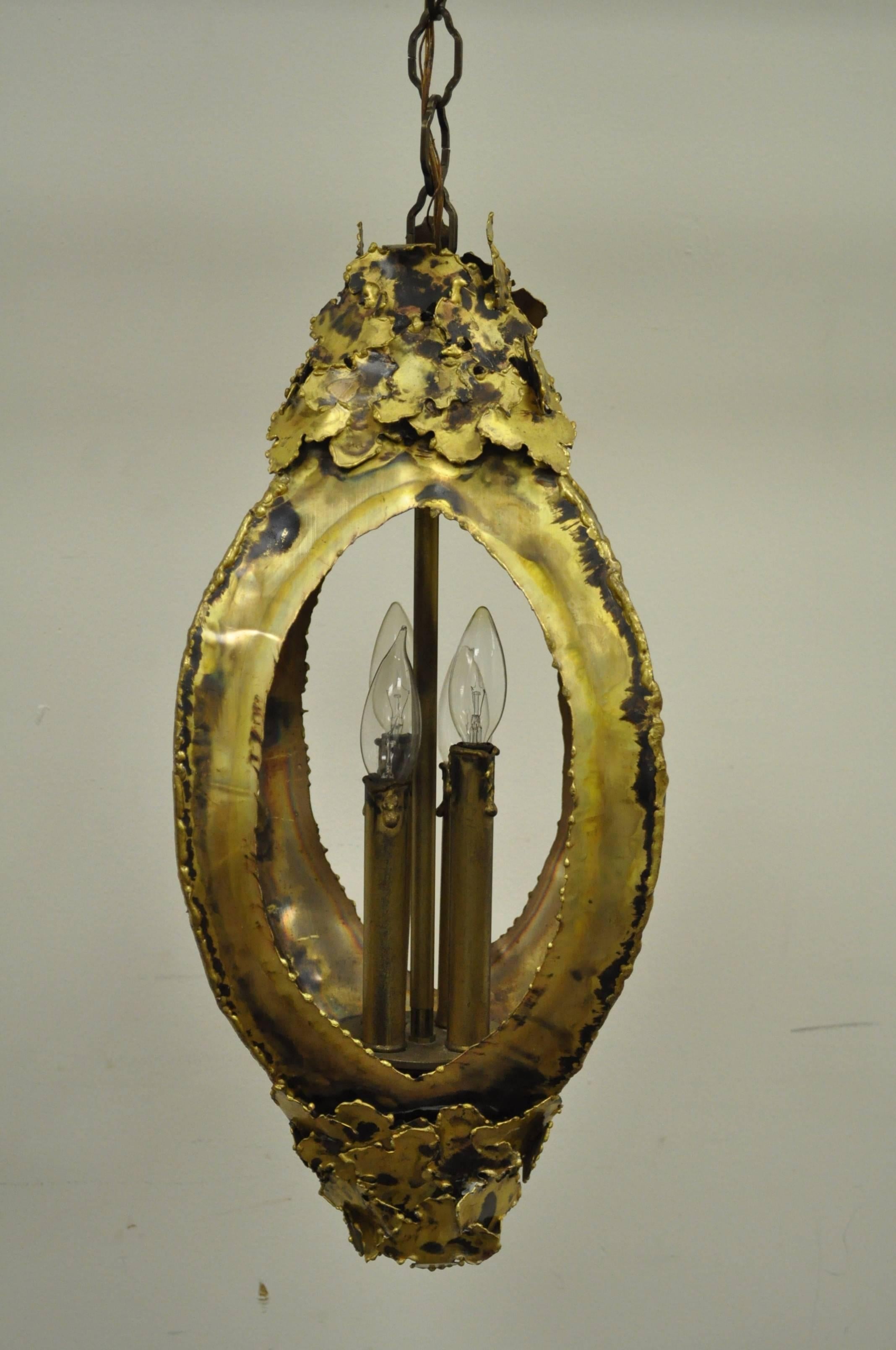 Vintage, Mid-Century Modern, Brutalist lantern pendant designed by Tom Greene for Feldman with four interior lights.