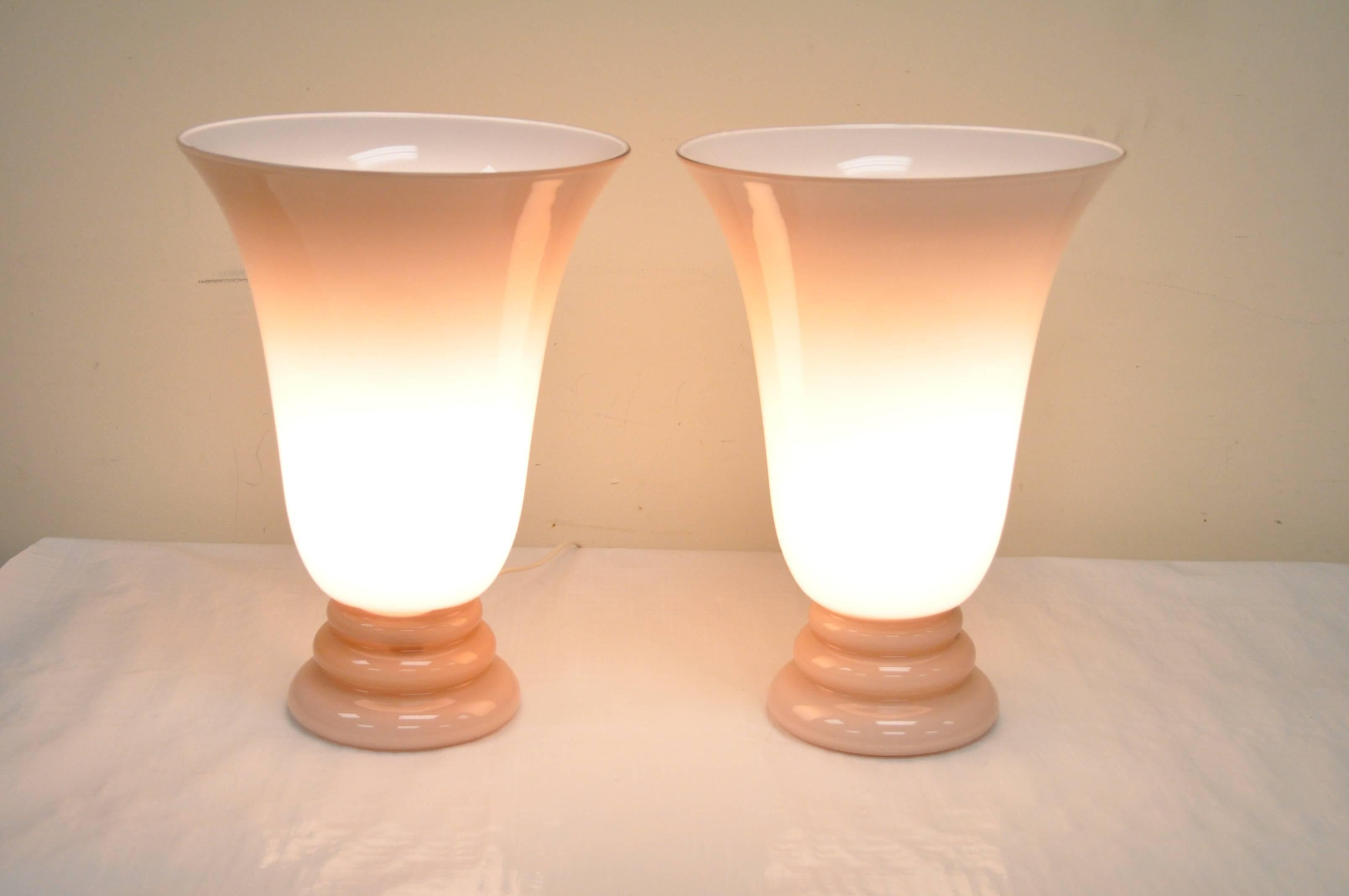 Elegant pair of Mid-Century Modern / Hollywood Regency Murano pink glass urn form table lamps.