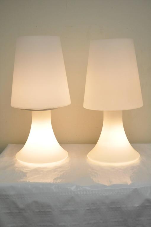 Great pair of Mid-Century Modern / Hollywood Regency Italian frosted glass table lamps by Laurel. Each lamp has a light in the shade as well as the base. Very elegant and attractive pair.