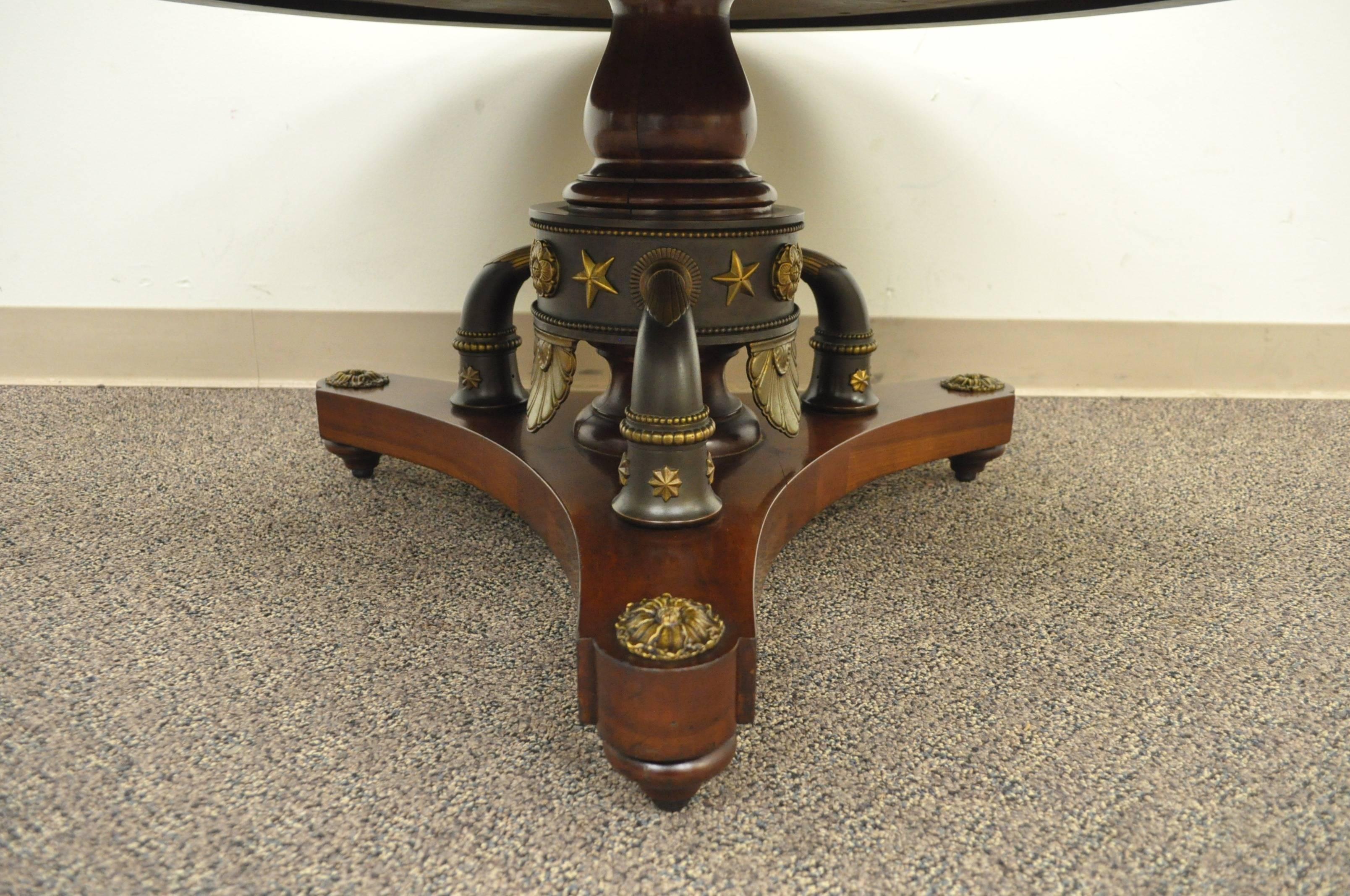 An exceptional custom made vintage coffee table with a burl wood inlaid cherry top. The base is believed to be a converted French Empire style chandelier. The feet have ball bearing casters, and are accented with bronze mountings with bronze
