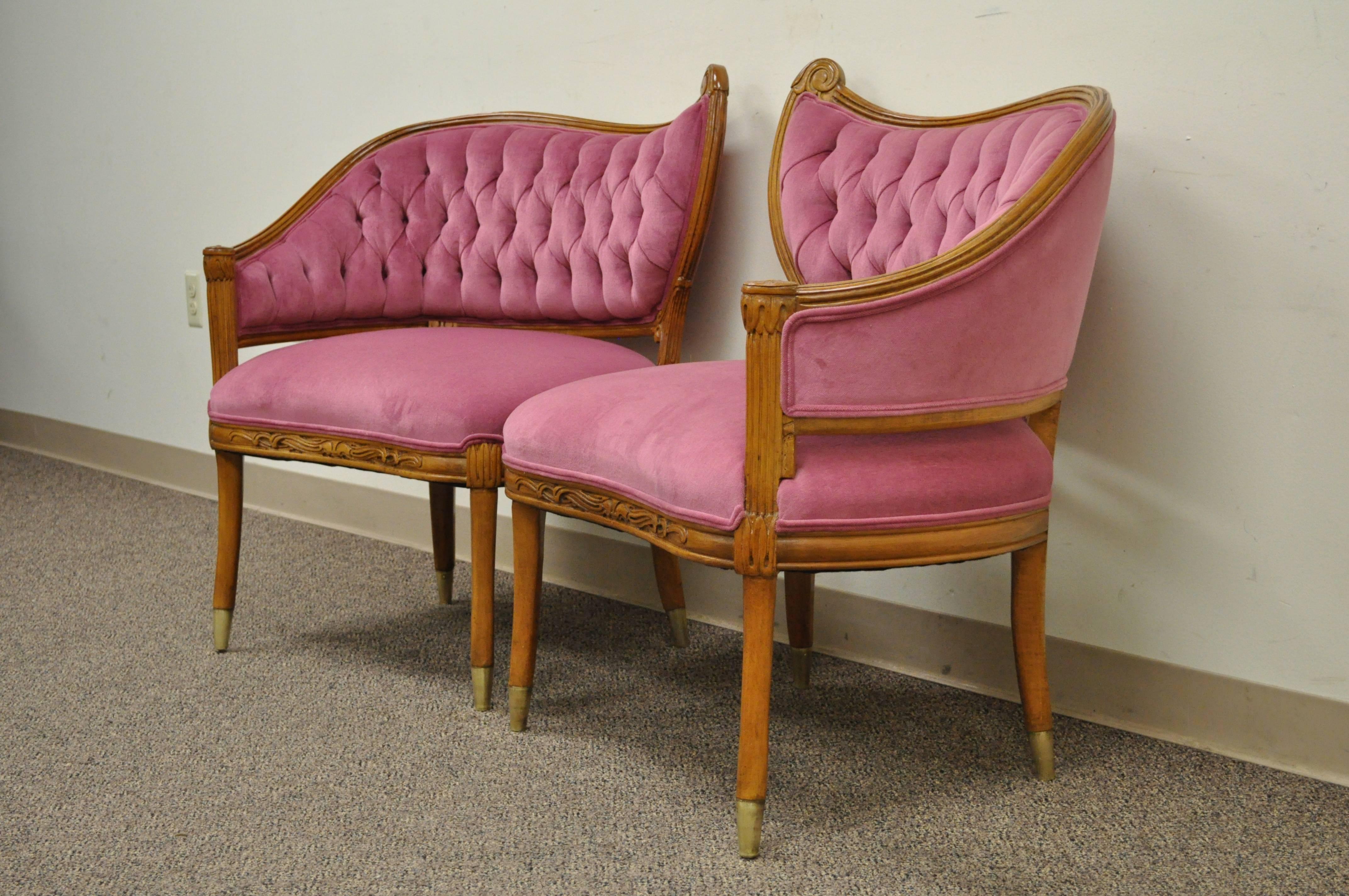 Wonderful pair of vintage Hollywood Regency French style lounge chairs. The pair features curved backs, brass capped feet, tapered legs, reeded carvings and very elegant form. The maker is unconfirmed but the form and quality is very similar to