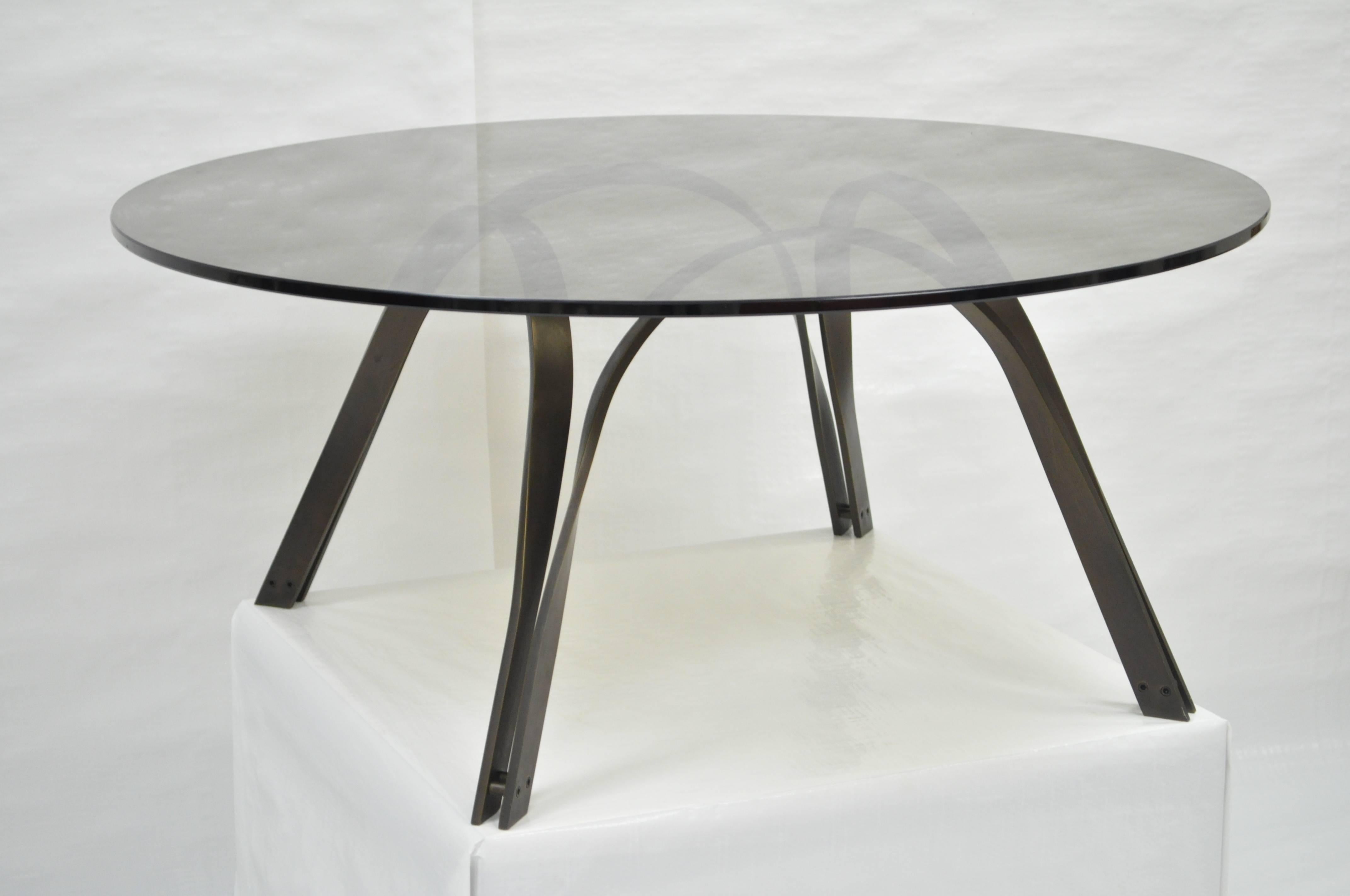 Vintage Mid-Century Modern sculptural heavy steel and smoked glass coffee table by Trimark in the manner of Roger Lee Sprunger for Dunbar. Item features a very rare bronze finish to the steel frame. Can be used facing up or down with examples