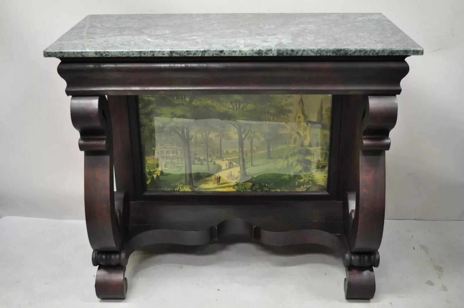 Antique American Empire Mahogany Green Marble Top Console Hall Table. Item features serpentine column supports, art print scene in glass, beautiful wood grain, very nice antique item. Circa Late 19th Century. Measurements: 34