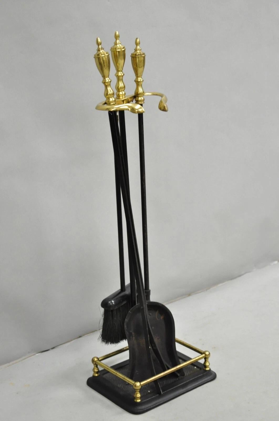 Vintage Federal Style Brass Urn Finial Cast Iron Fireplace Tool Set - 4 Pc Set. Listing includes (1) stand, (1) shovel, (1) broom, and (1) set of tongs. Circa Late 20th Century. Measurements: 31