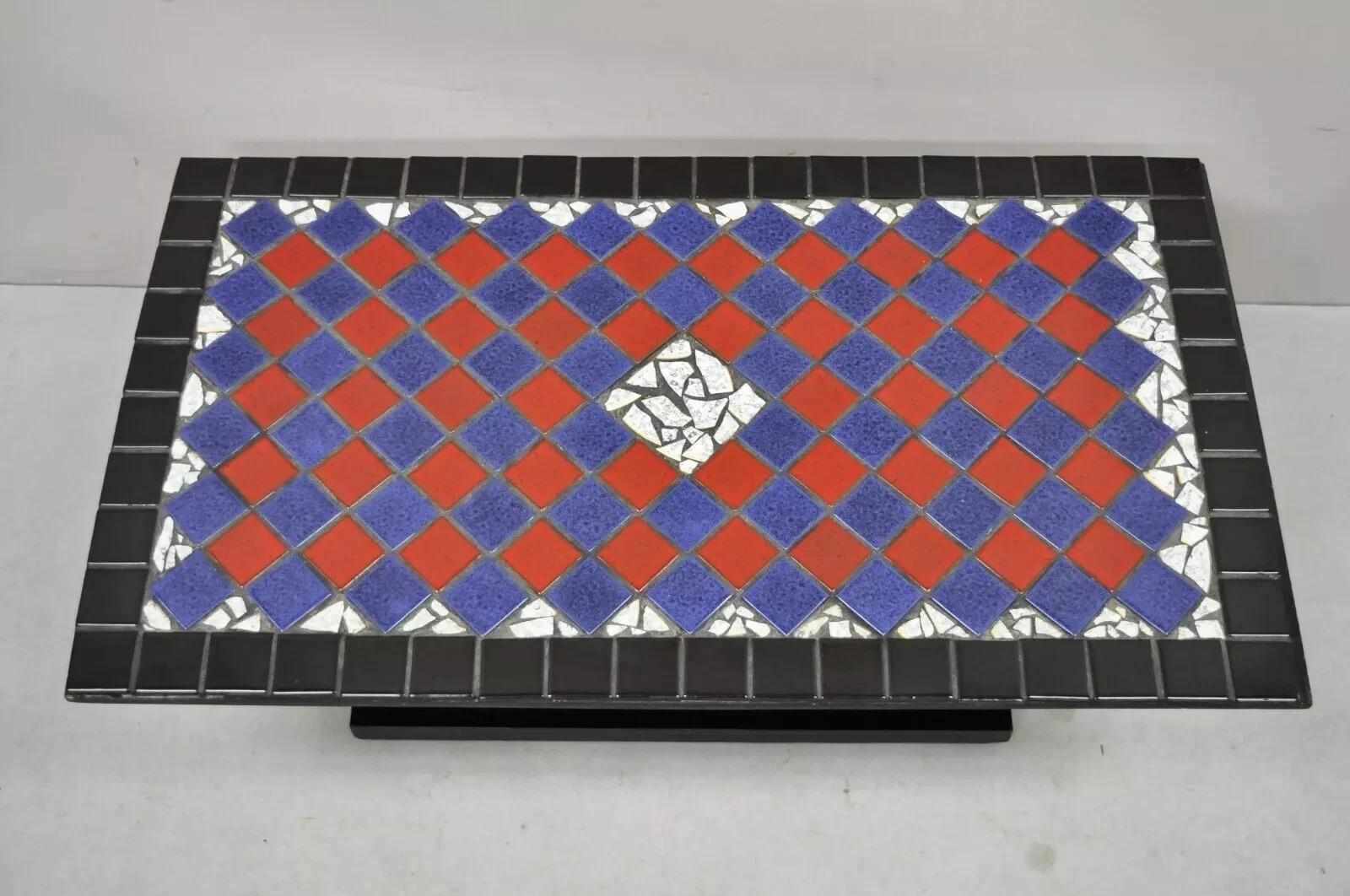 Please message us with your zip code to request a more reasonable domestic U.S. shipping quote.

Vintage Art Deco Blue and Red Mosaic Tile Top Arch Base Coffee Table. Item features a mosaic porcelain and ceramic tile top, arched pedestal base, very