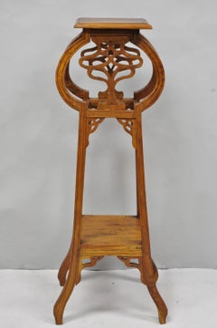 Table d'appoint vintage de style Art nouveau français, en teck sculpté, sur pied, servant de support pour plantes
