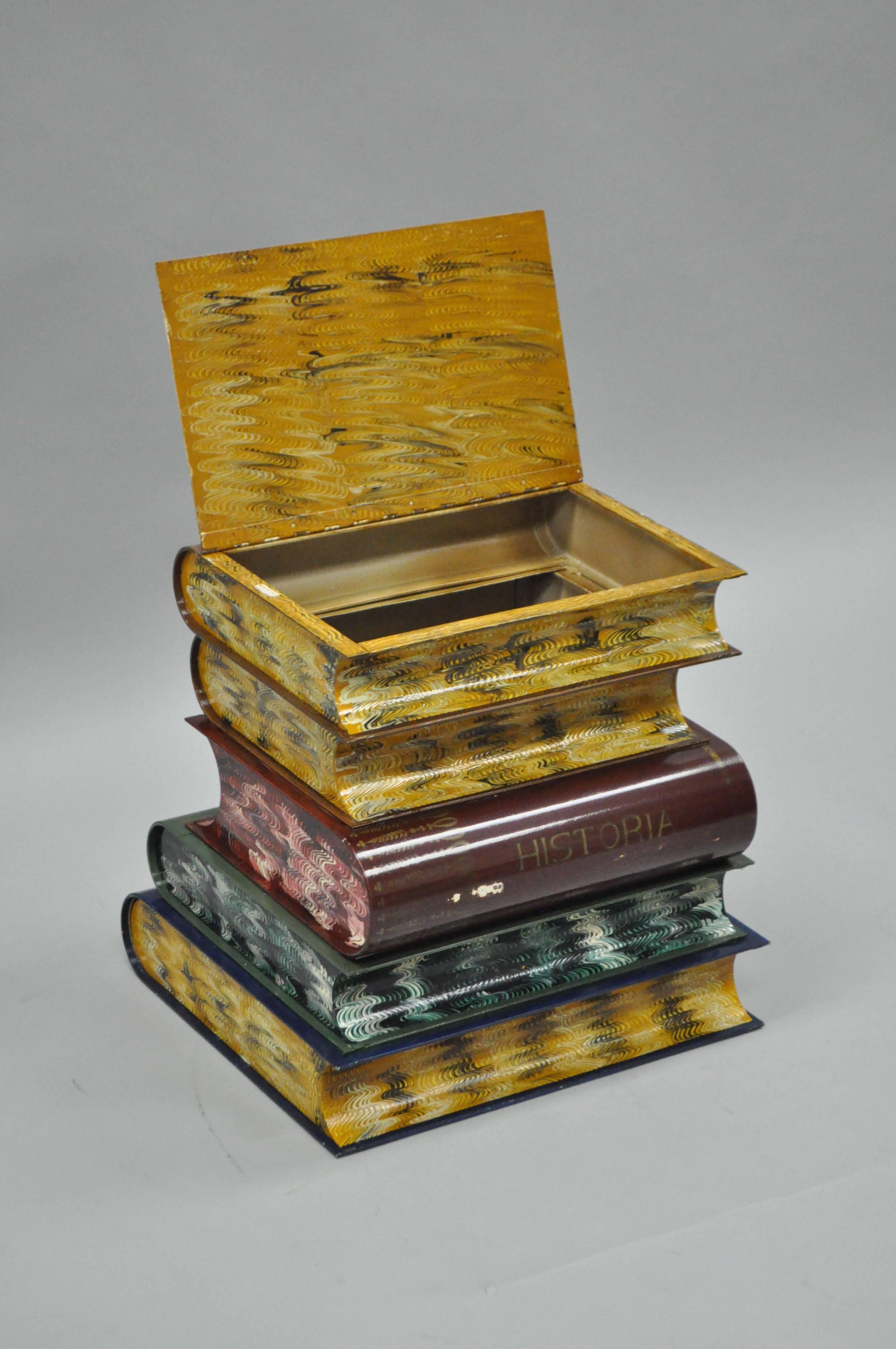 Whimsical Italian Hollywood Regency stacked book form toleware flip-top accent table. This vintage item is constructed of steel with hand-painted faux leather bound book detailing and painted on all sides with marbled edges. Made in Italy. 