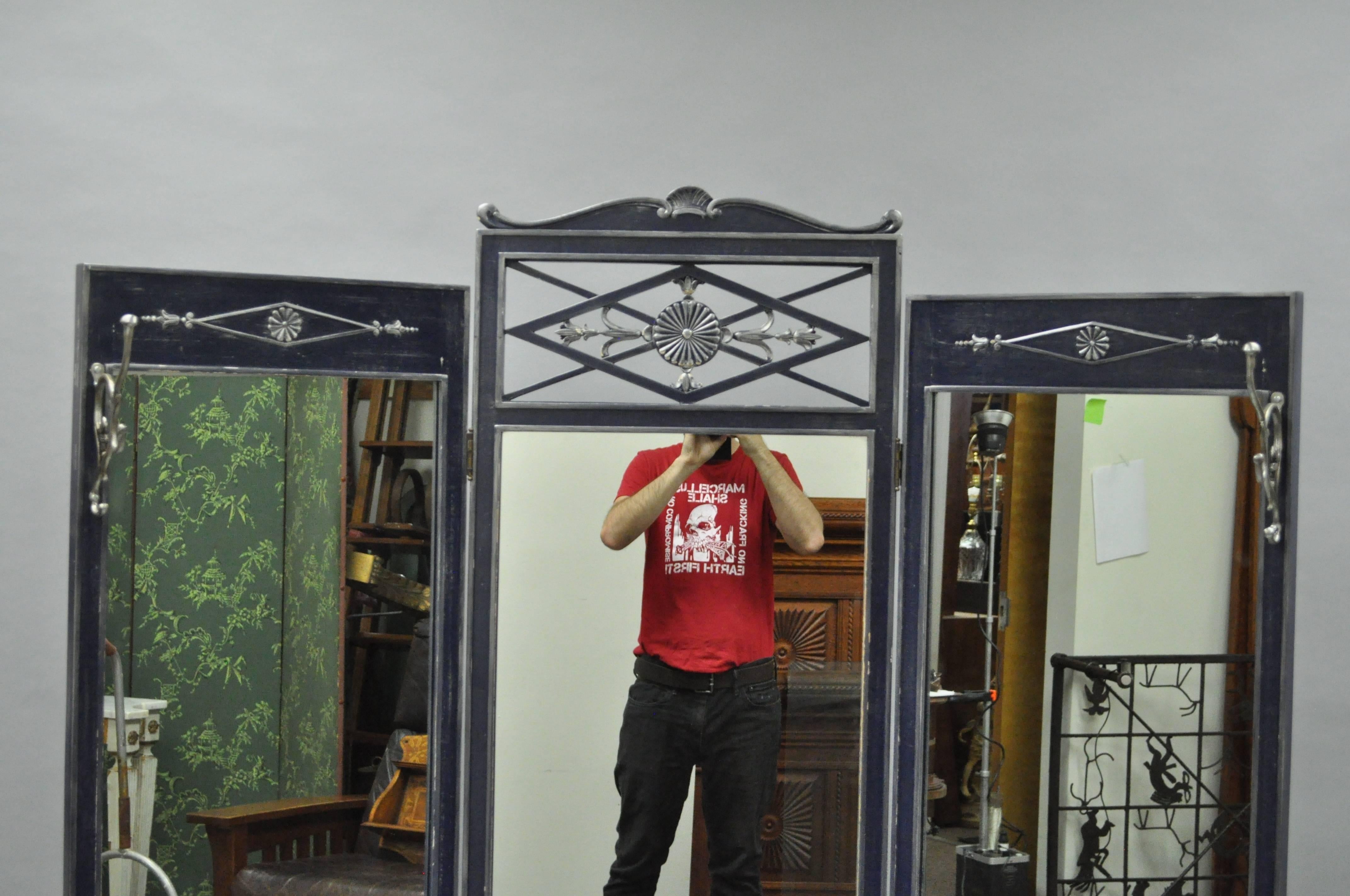 Very unique vintage French Louis XVI style full length tri-fold dressing mirror with a deep blue and silver distressed finish. Item features a folding form with pierce carved central detailing and other applied carvings. The right and left section