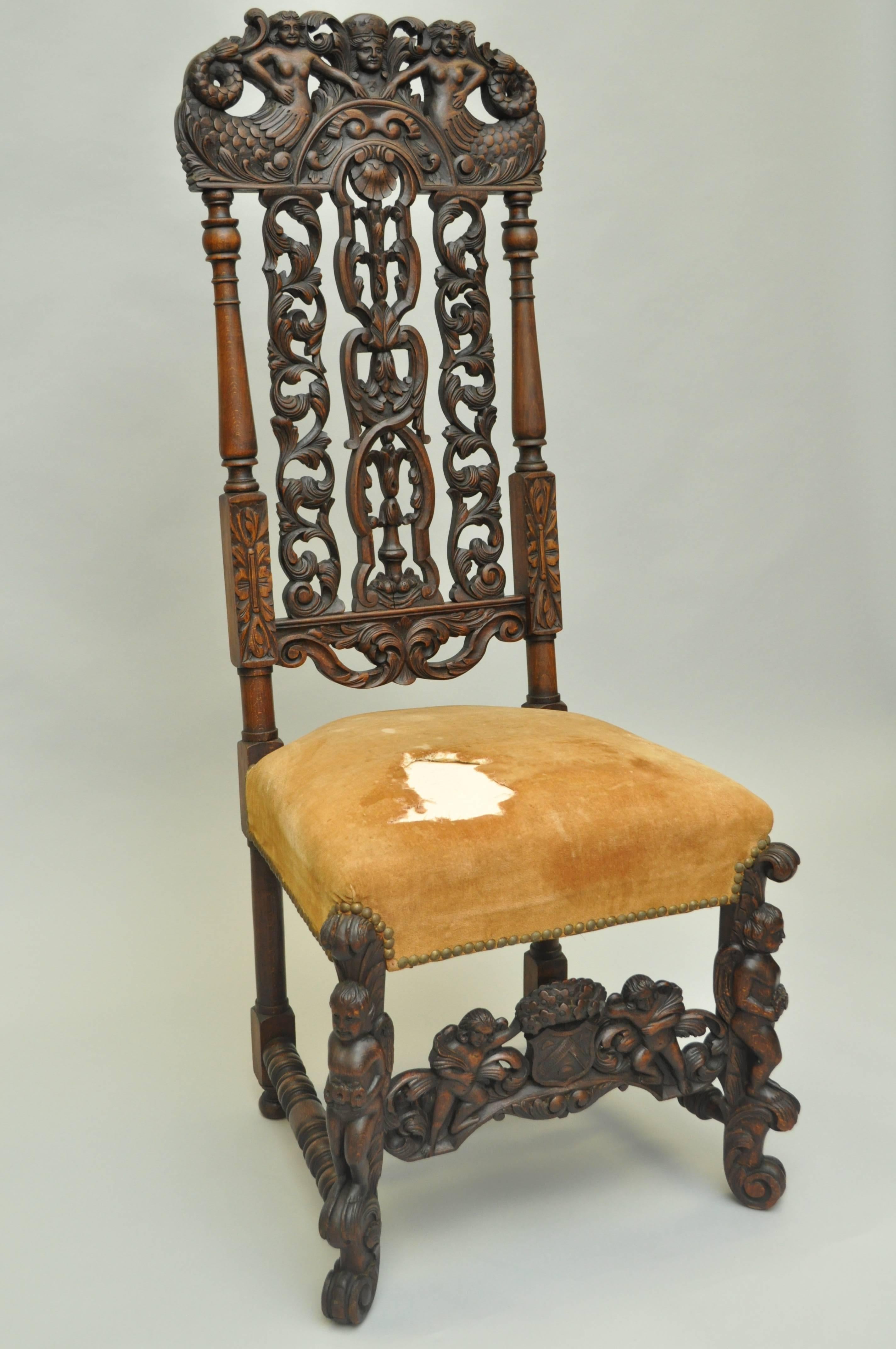 Finely carved 19th century solid walnut italian Renaissance tall back side chair. Item features an ornate fully carved solid walnut wood frame with Mermaids on the crest and winged cherubs on the legs and stretcher. The chair is further accented