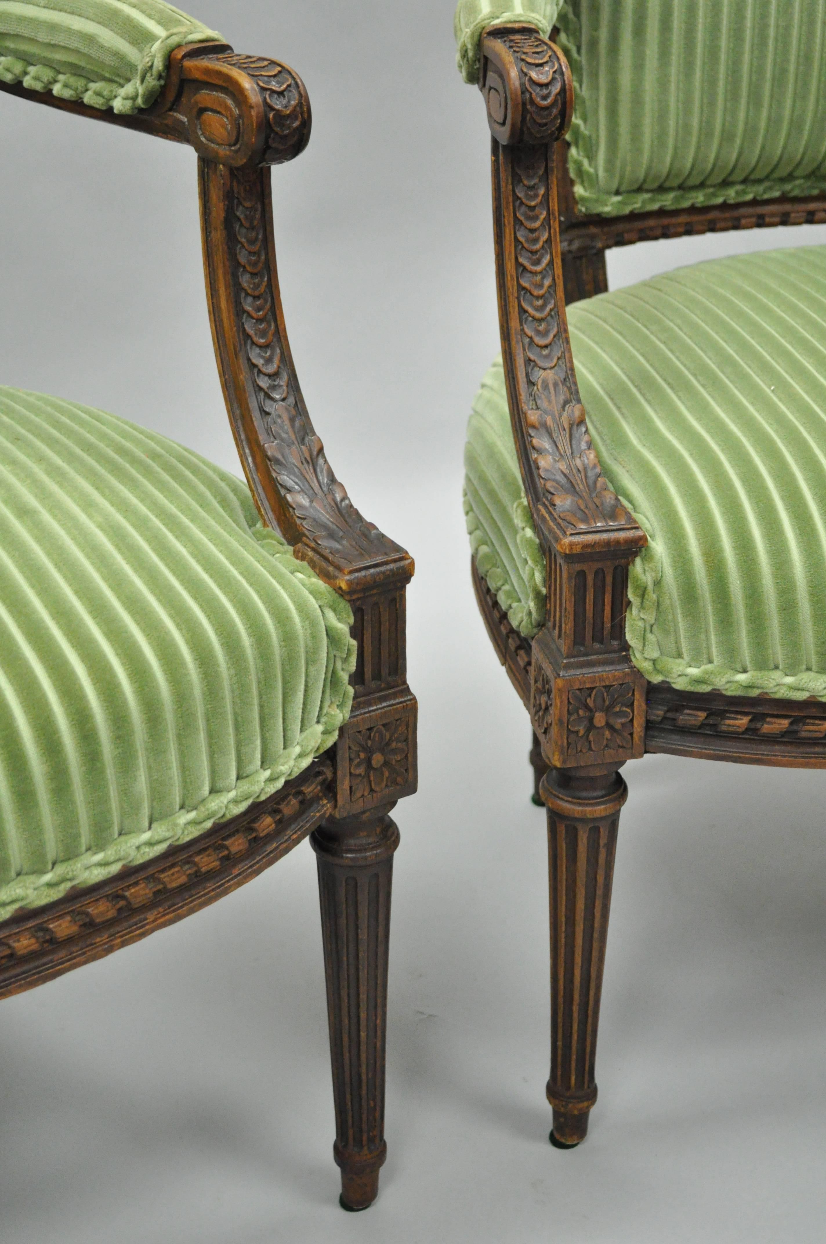 Pair of French Louix XVI Directoire Carved Walnut Green Fauteuil Arm Chairs In Good Condition In Philadelphia, PA