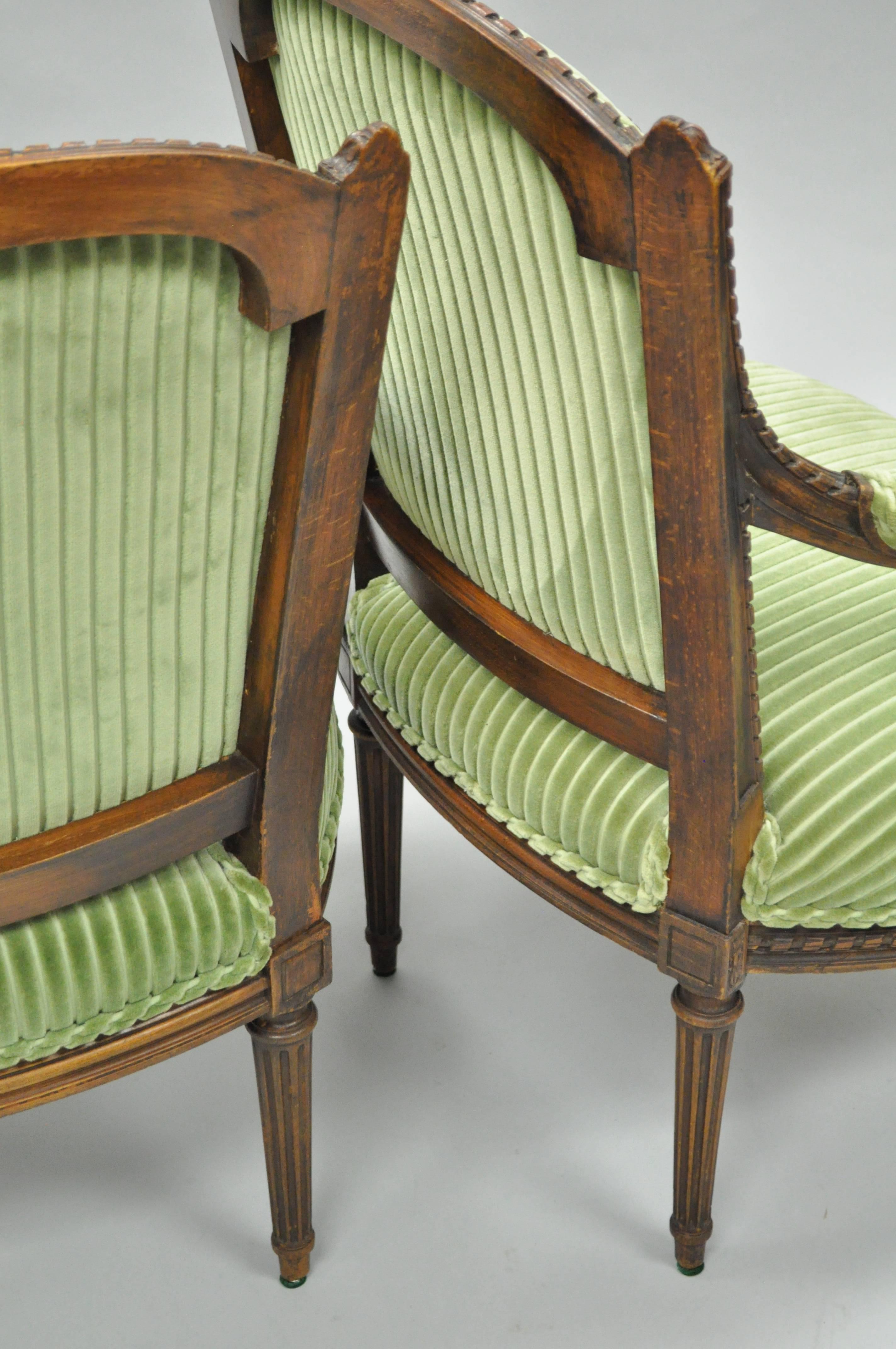 Early 20th Century Pair of French Louix XVI Directoire Carved Walnut Green Fauteuil Arm Chairs