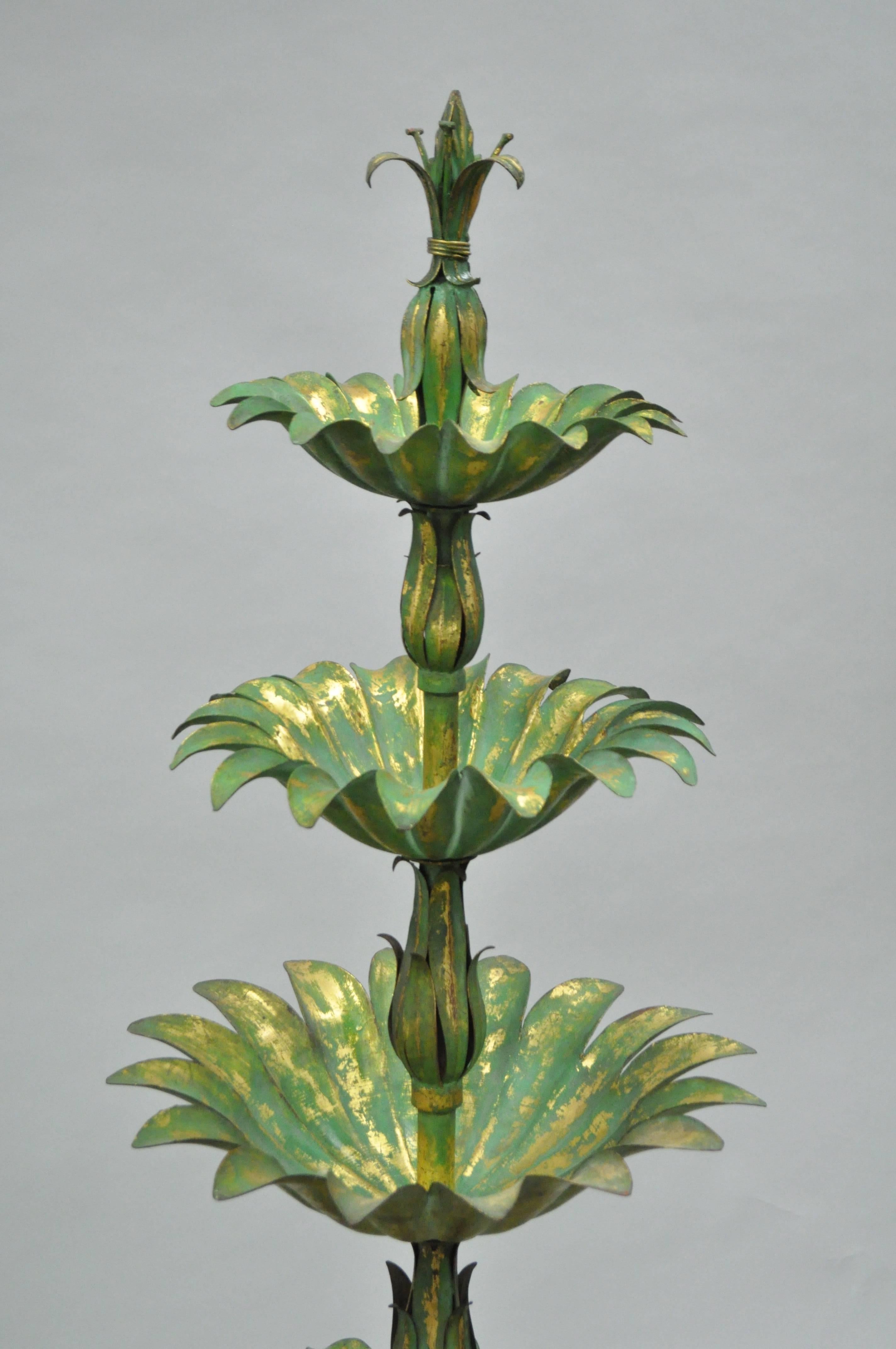 Vintage Italian Mid-Century green and gold gilt iron decorative planter object. Item features a solid iron graduating frame with an attractive antiqued gold gilt verdigris finish, four feathered tiers, and a plume / feathered pedestal base. Original