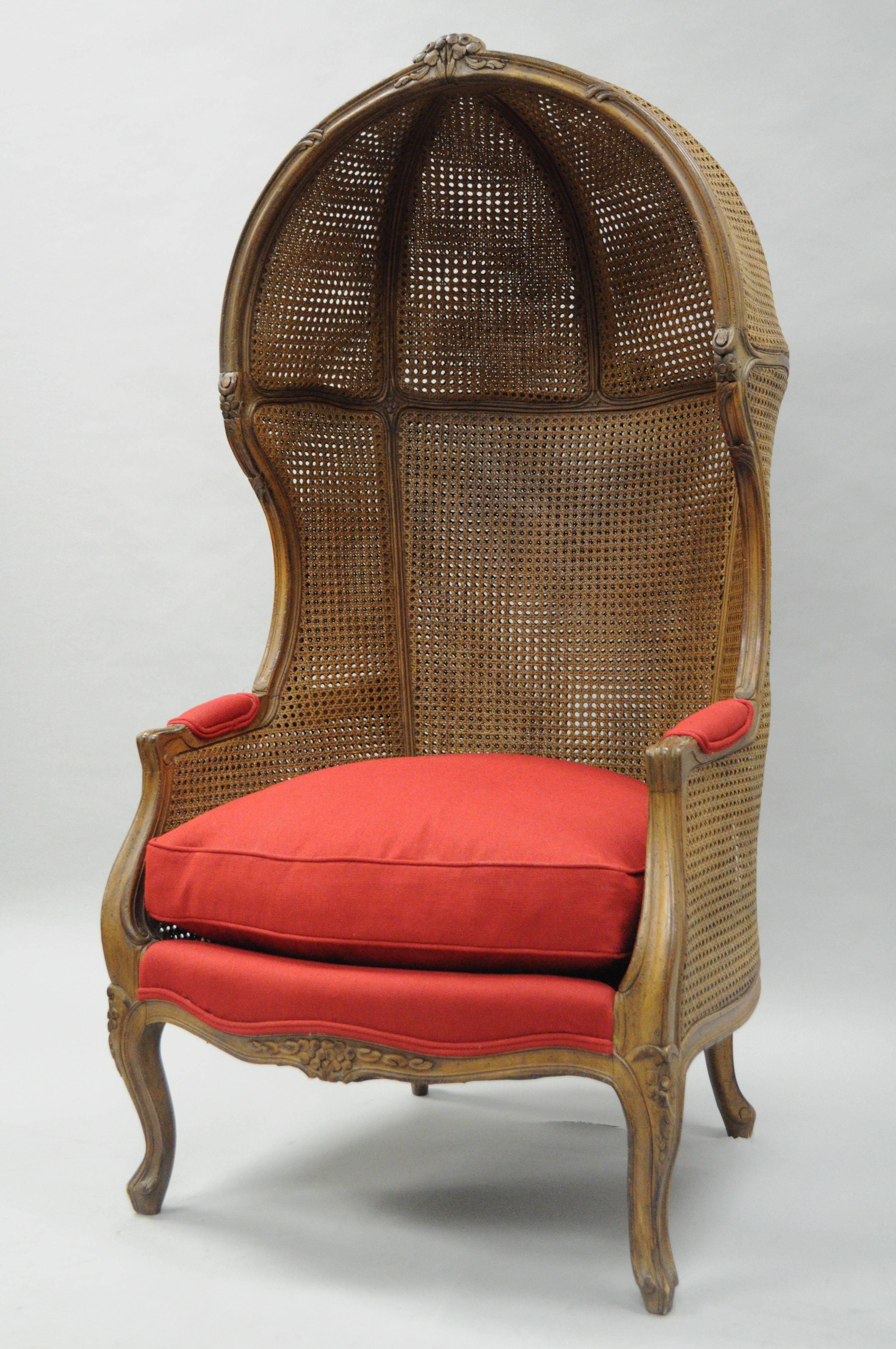 Vintage French Country / Louis XV style double cane Italian canopy Porter's chair. Item features a double caned solid carved walnut Italian frame, red upholstery, down filled loose cushion, Classic French style.