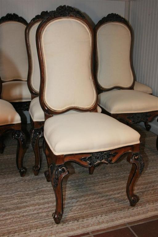 Wonderful Set of 8 Vintage Custom Quality Upholstered Dining Chairs in the Baroque style having the original lightly distressed paint decoration, shapely walnut frames, carved and decorated front and back knees, and great form. Very high quality