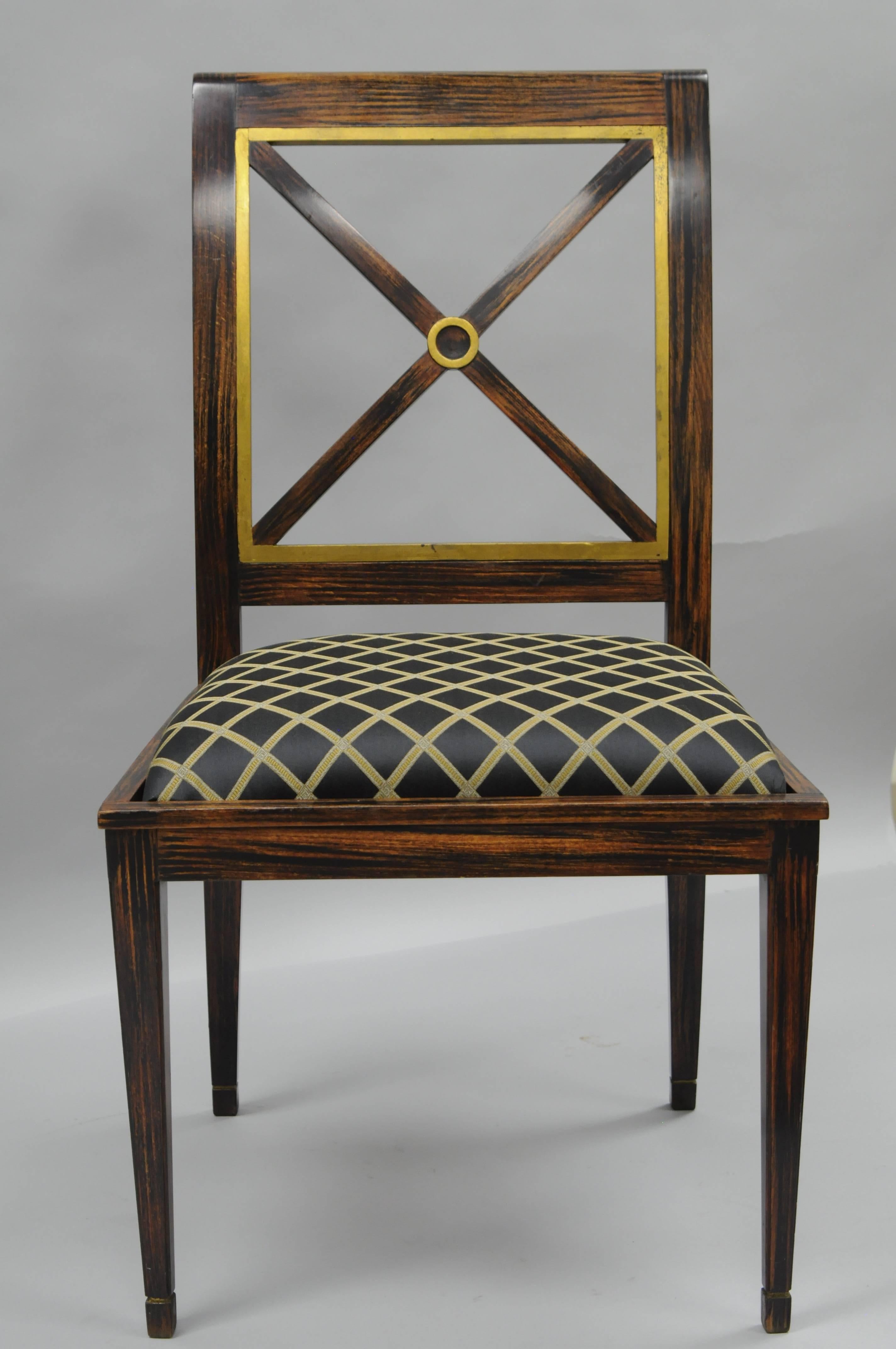 Vintage neoclassical/Directoire style side chair having a hand-painted rosewood grain finish to the solid wood frame. Chair features a slightly rolled back, angled and tapered legs, x-form backrest, gold leaf accents, and an upholstered seat in a