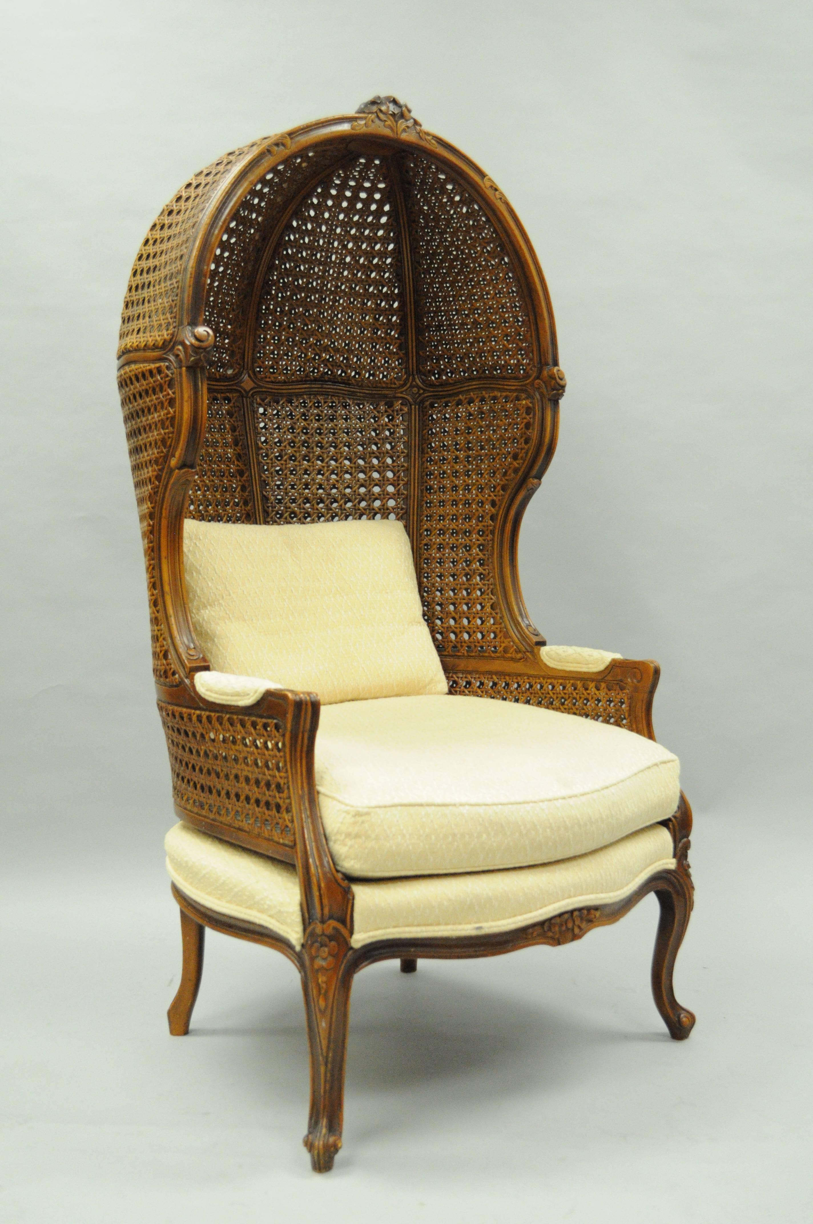 Vintage French Country / Louis XV style double cane Italian canopy Porter's chair. Item features a double caned solid carved walnut Italian frame, beige upholstery, loose back pillow, Classic French style.