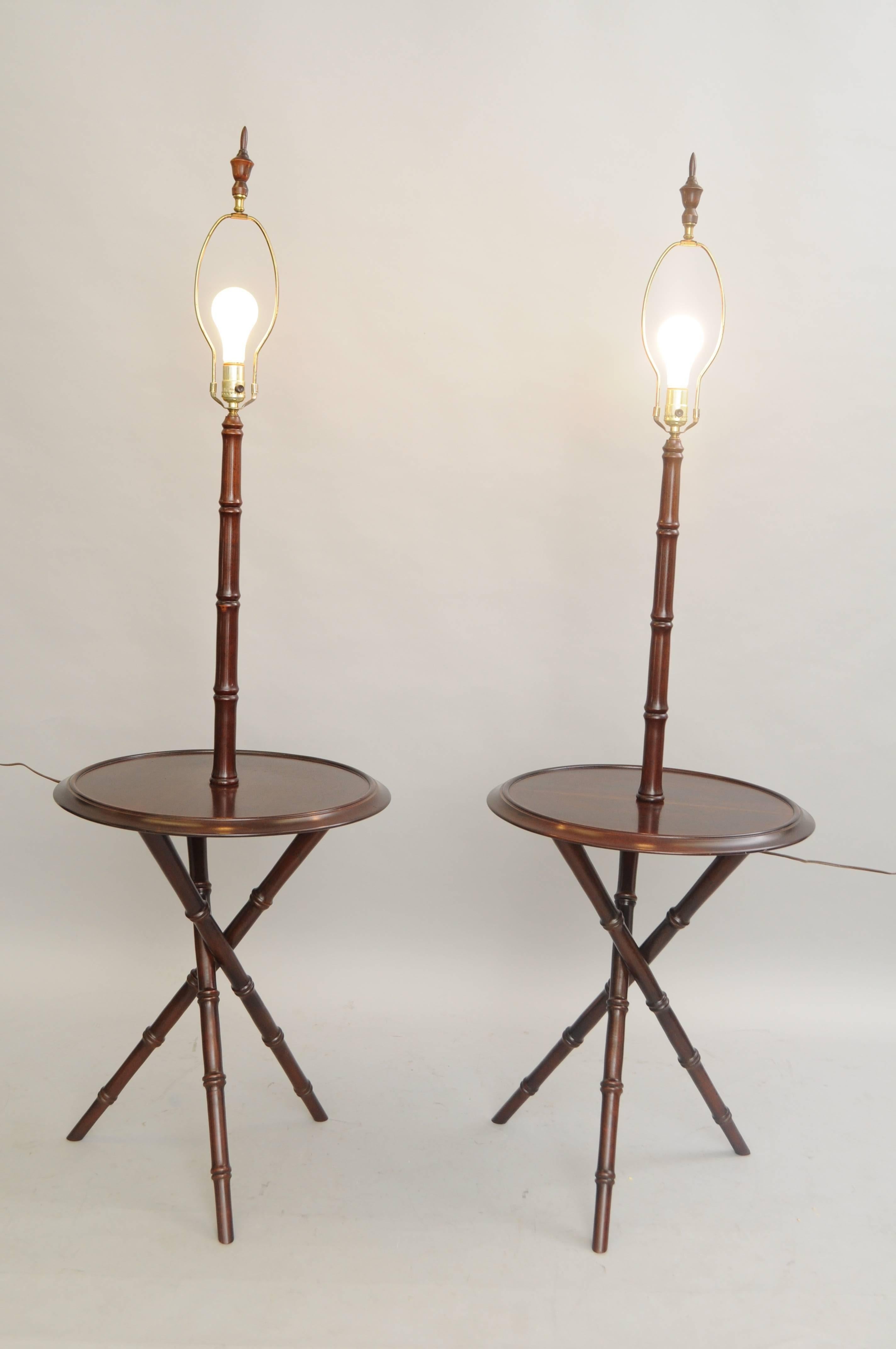 Pair of Vintage Hollywood Regency / Chinese Chippendale style cherrywood lamp tables. Item features cherrywood construction, tripod faux bamboo bases, 20
