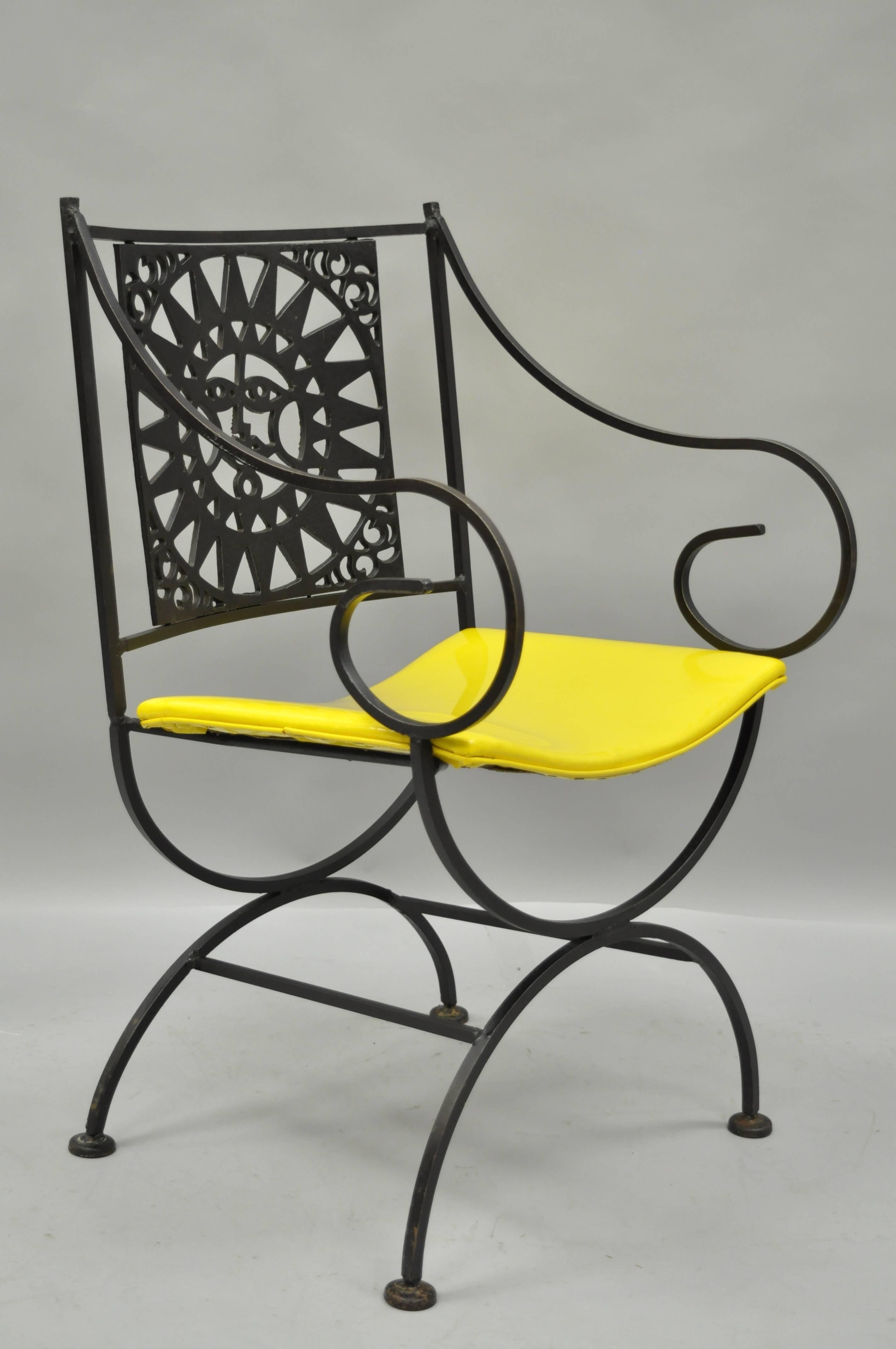 Vintage Mid-Century Modern, 1960s. Wrought iron directors chair with sun back from the Mayan Collection by Arthur Umanoff. This wonderful handcrafted chair features a unique X-form base, whimsically scrolled arms, and bright yellow vinyl seat.