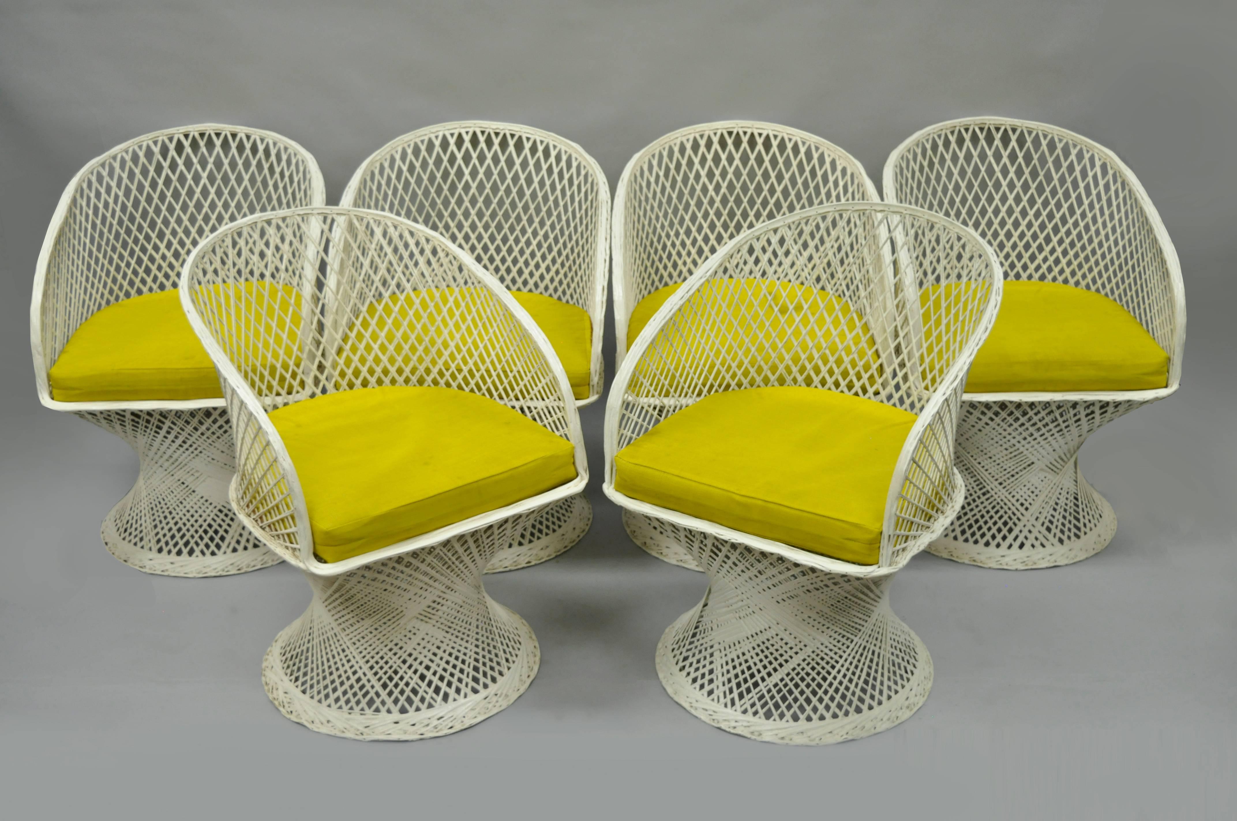 Rare vintage Mid-Century Modern Russell Woodard spun fiberglass seven piece dining set. This particular model is very rare due to the much higher quality construction and attractive form. The amount of fiberglass woven into the frame is noticeably