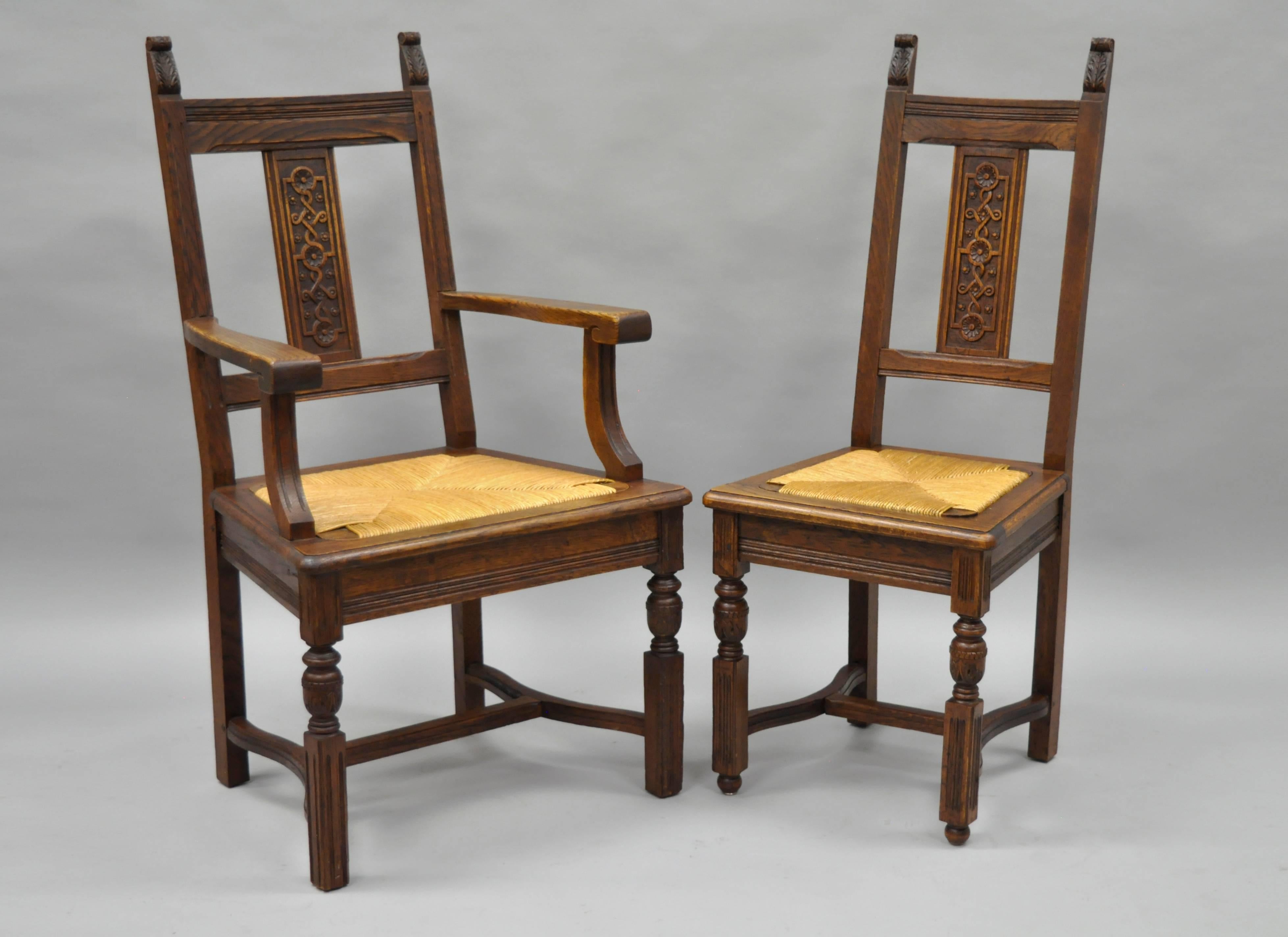 Set of eight antique William & Mary renaissance revival style carved oak dining chairs with woven rush seats. This quality set features six side chairs and two armchairs with solid carved oakwood frames, exposed wooden dowel joinery, spiral carved