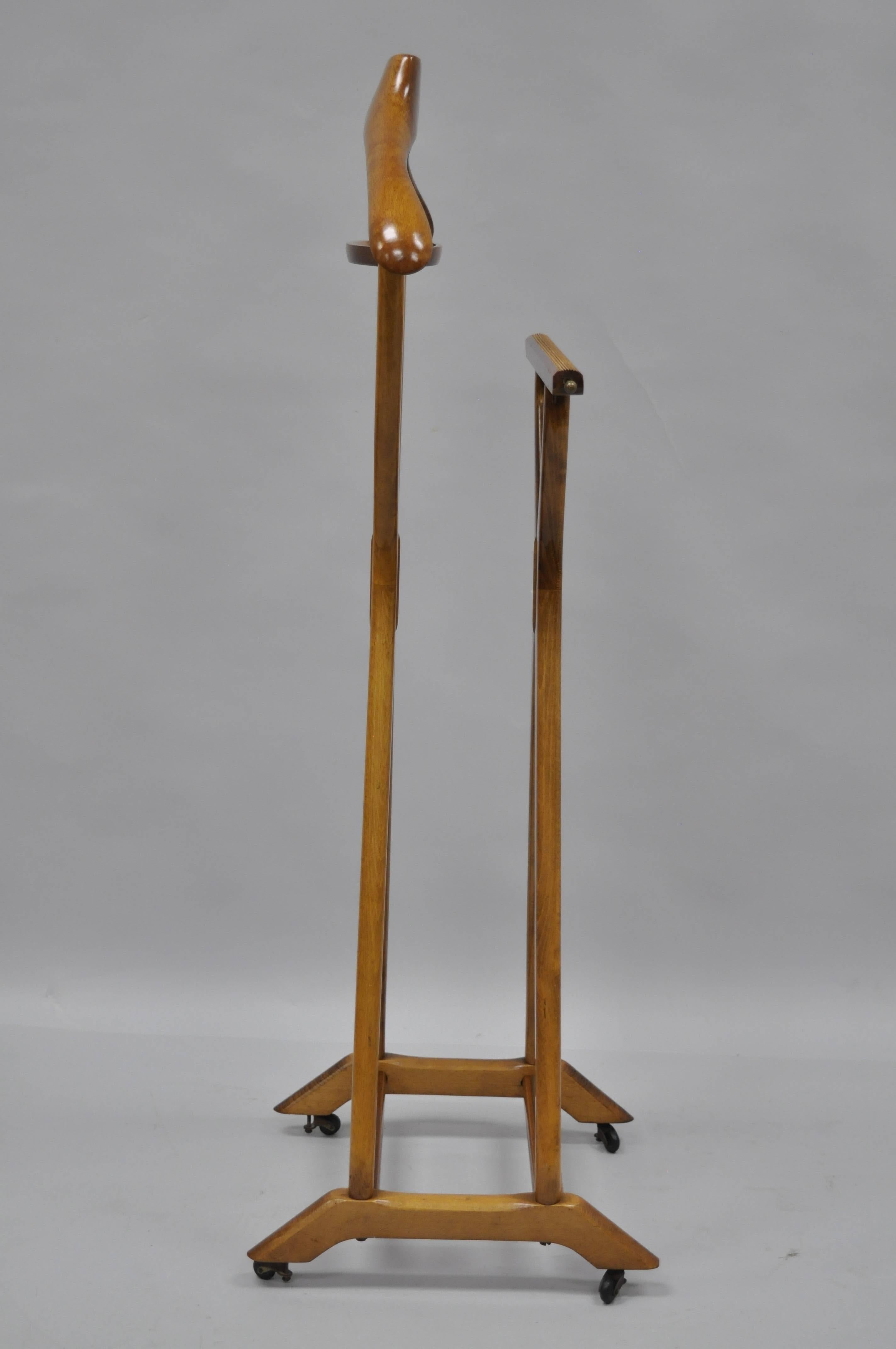 Vintage Italian Modernist X-Form Clothes Valet Stand designed by Ico Parisi, Made in Italy by Fratelli Reguitti. This Mid Century Modern Item features a solid wood frame, double stand (one for pants and one for suit jacket), change dish, shoe rest,