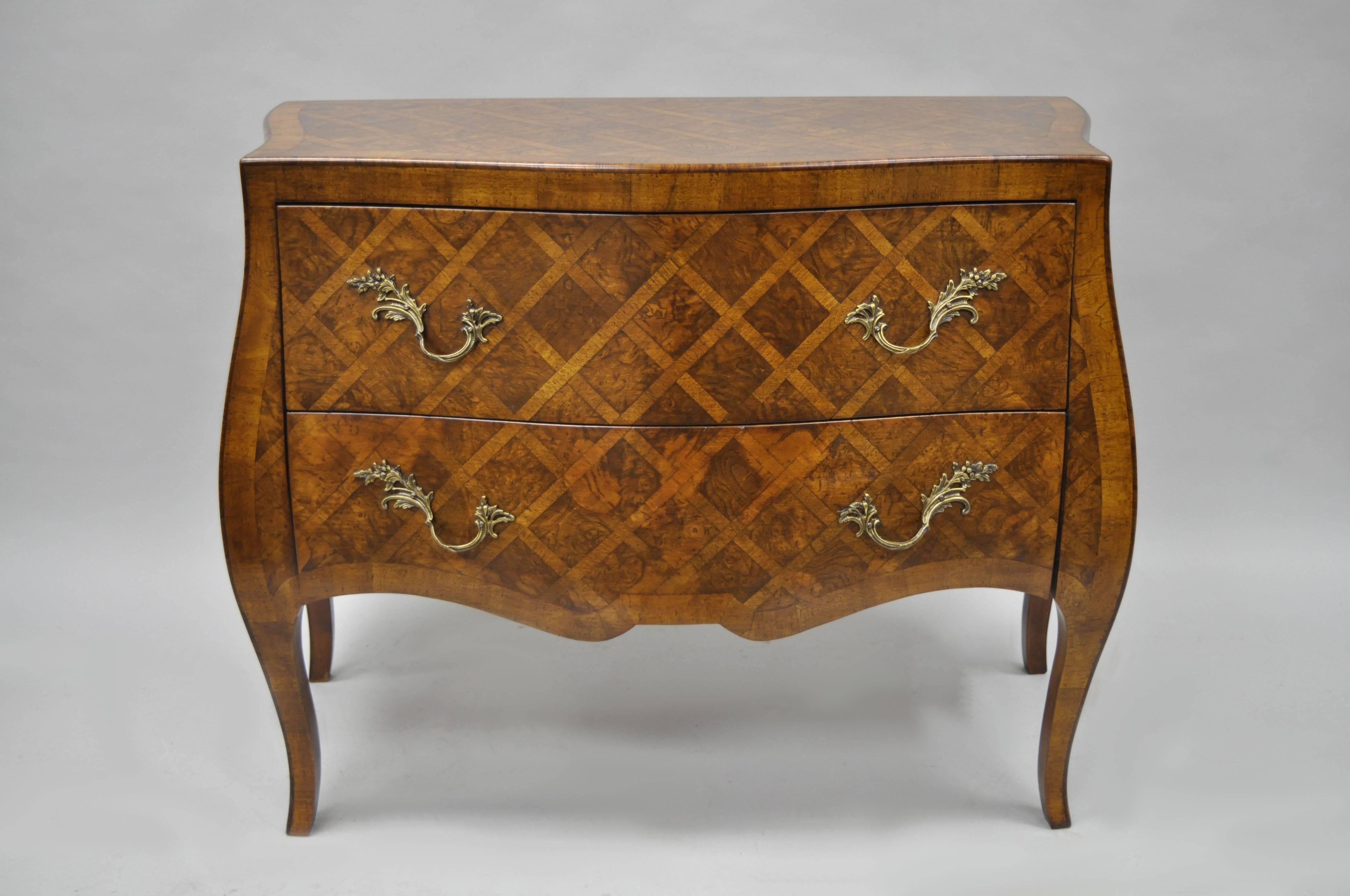 Vintage Italian Parquetry Inlaid Bombe Commode in the French Louis XV Style. Item features two drawers, brass hardware, shapely cabriole legs, and stunning parquetry inlay. Marked Italy