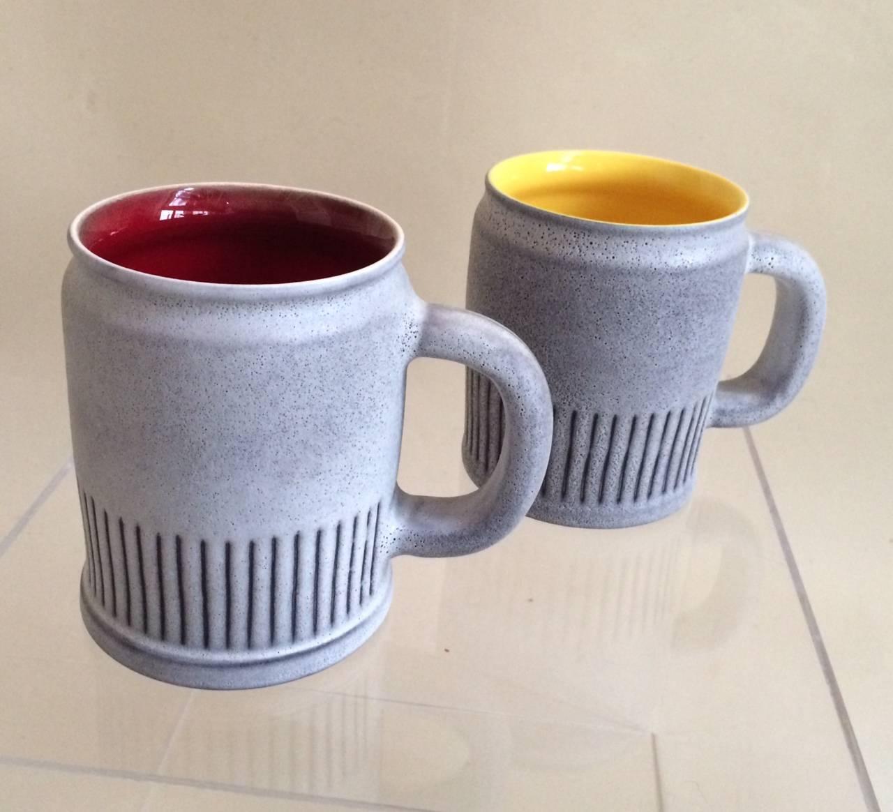 André BAUD Vallauris (1903-1986 )
A Set of  4 BEER MUGS   designed by André BAUD(1903-1986 ) for his studio in Vallauris, c. 1950. It is made of earthenware with matt grey glaze and  graphic  decoration in carbon  black , with a polished red 