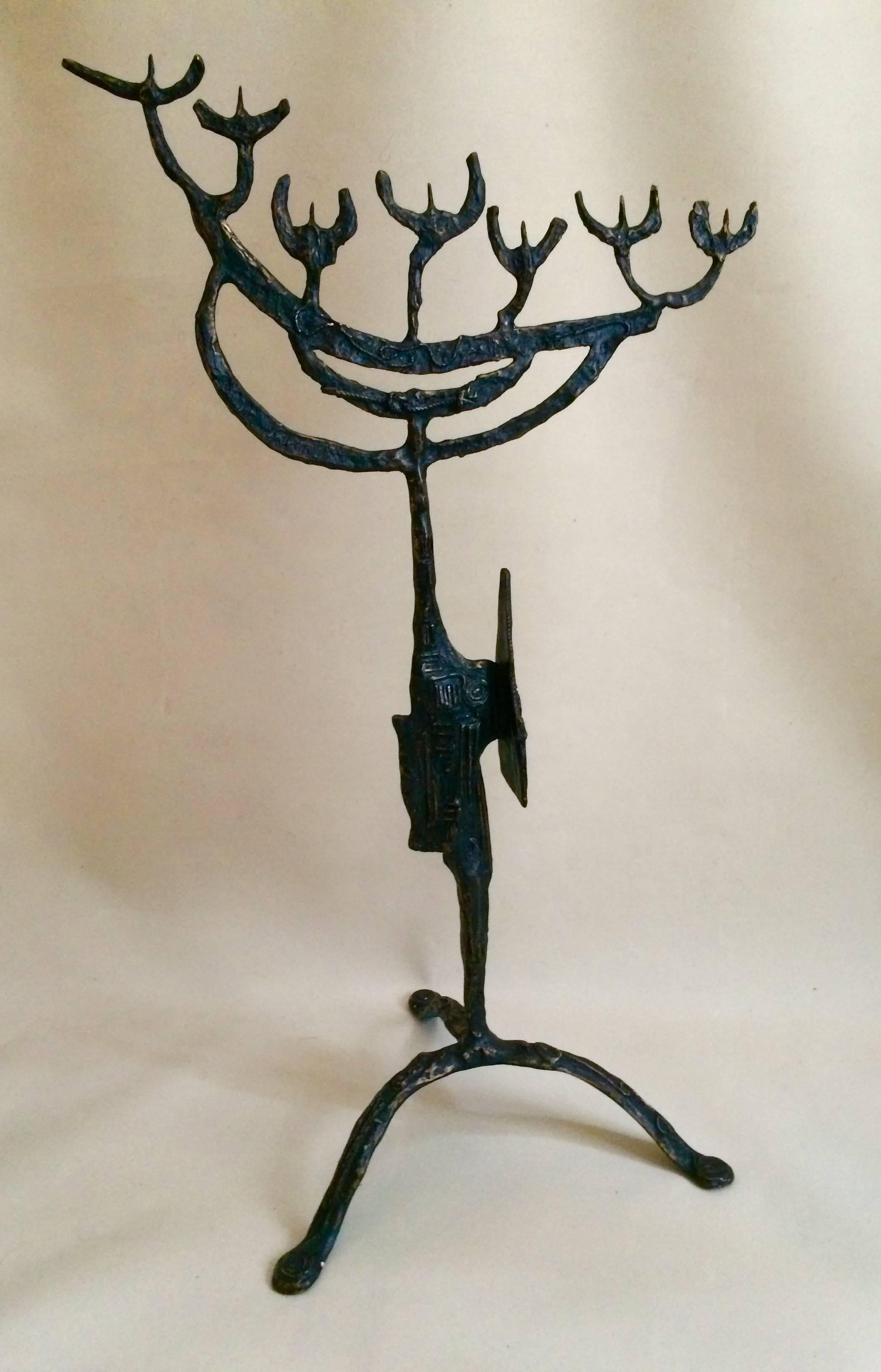 An impressive Mid-Century sculpted bronze menorah, finely engraved and carved with symbols and graphic of Jewish tradition combined with modern Brutalist art, quite sensational.

