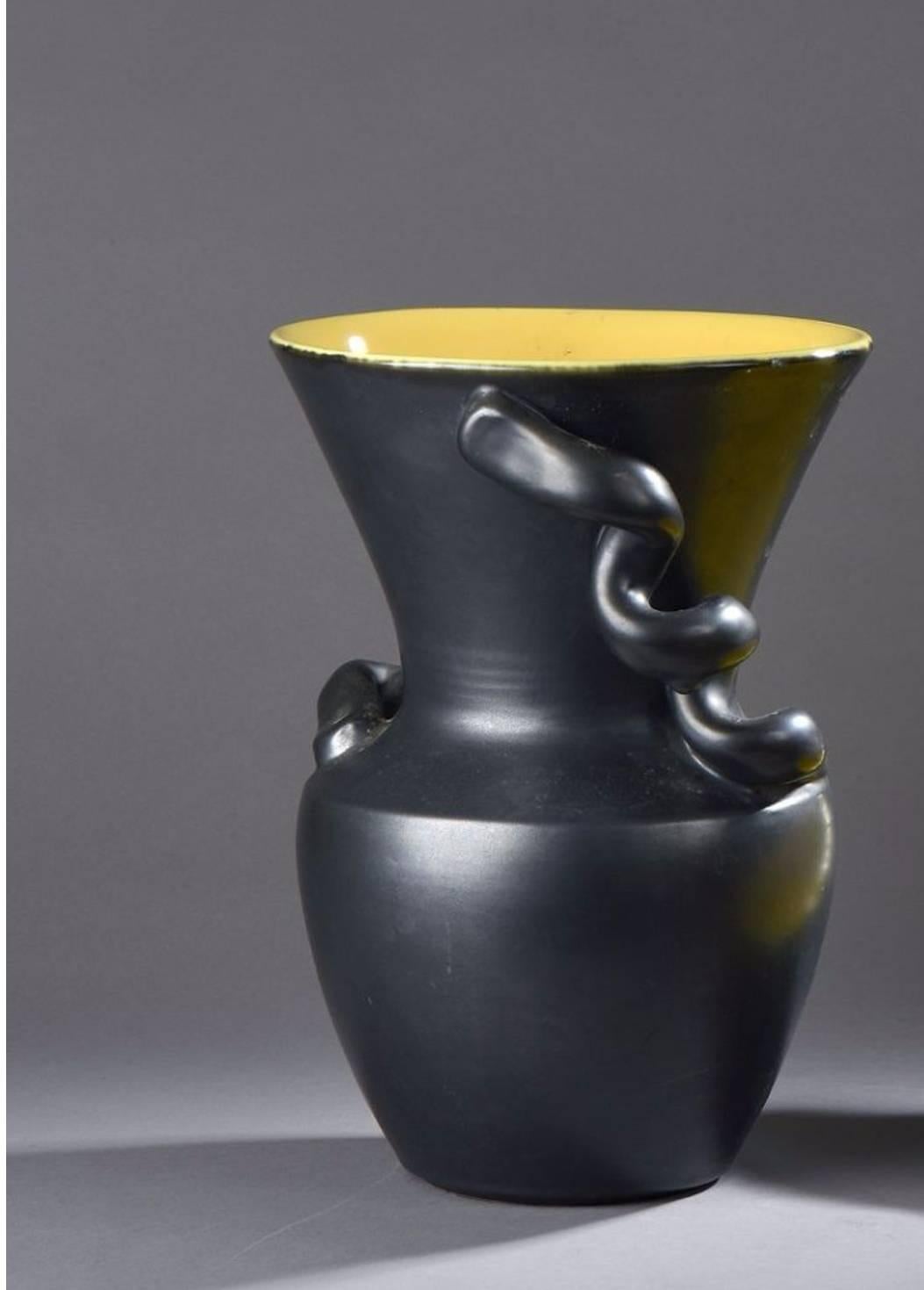 A vase and a shell shaped ceramic by renowned artist and ceramic maker Pol Chambost, France, circa 1950.
Stamped Vallauris on the vase base and "cachet d'artist" on the shell base.
In black enamelled and Yellow mustard.
Item sold