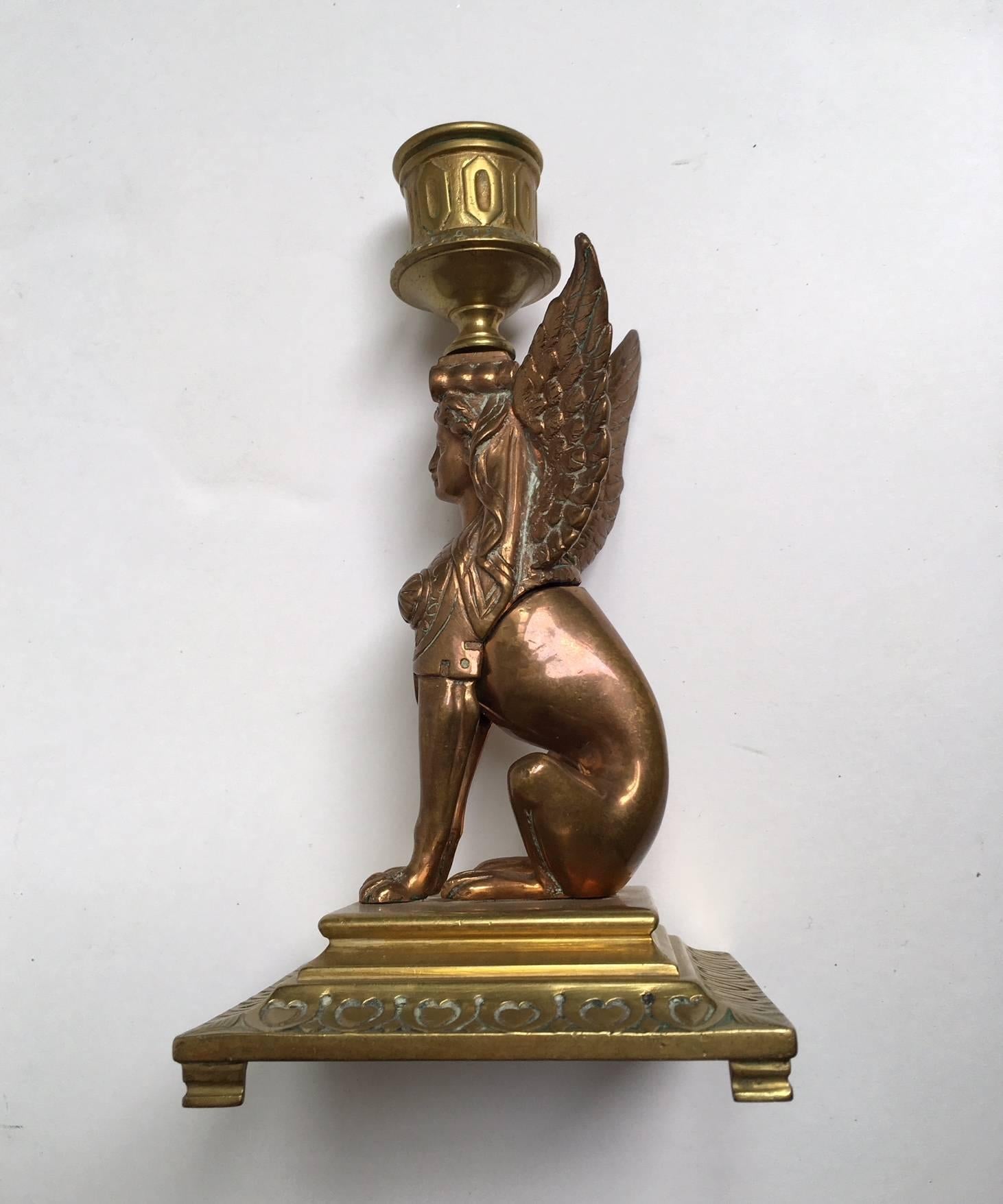 A pair of French Empire period pair of candleholder ,representing two sphinx ,in gilt and gilt coppered plate on bronze.
From an early cast of Ferdinand Barbedienne (1810_1892),edited lately in the 19th century ,when his nephew took over the firm