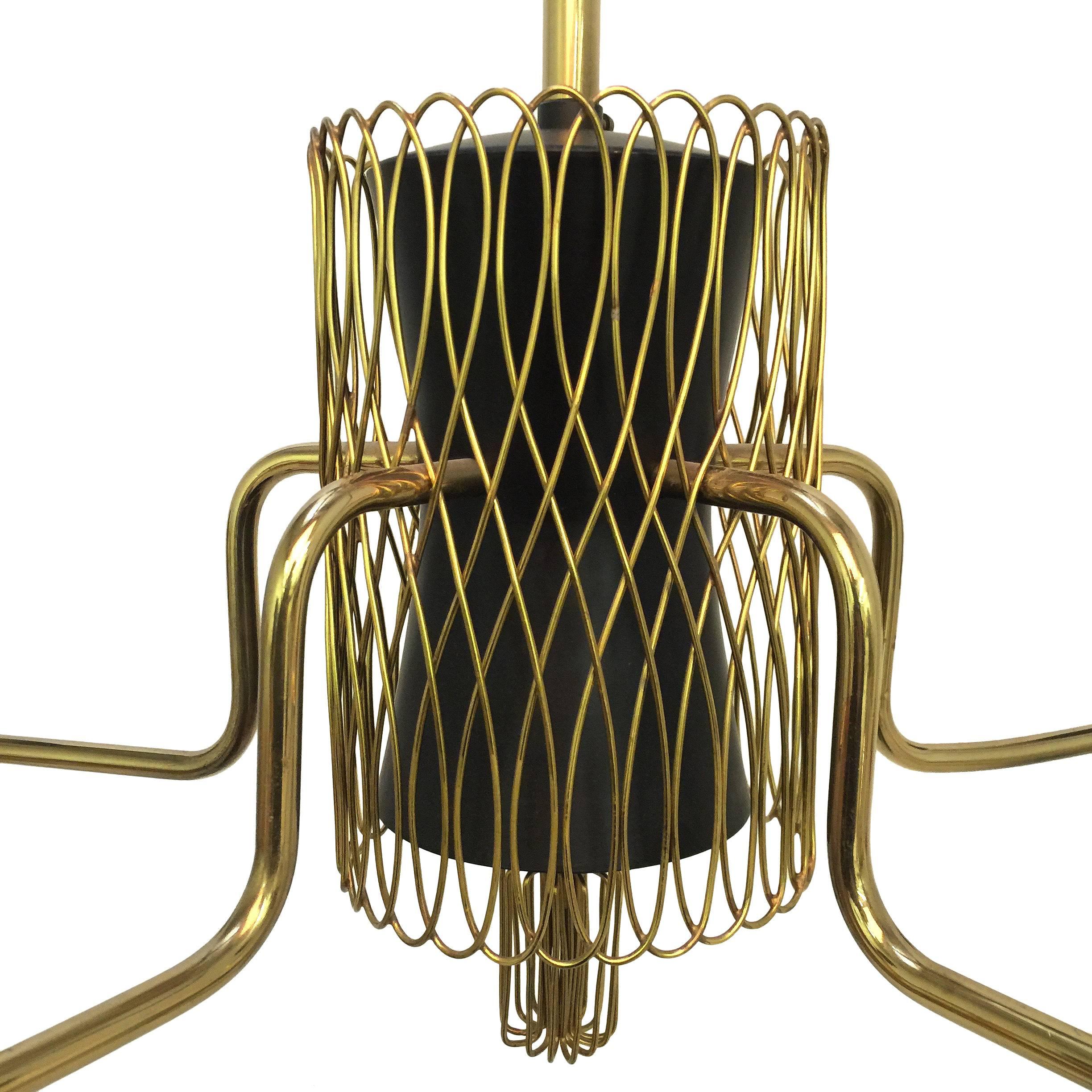 Such an incredible chandelier by Finnish Master Paavo Tynell for Idman. 

This example has everything you are looking for in a Tynell fixture. Solid brass construction, white glass shades, dazzling brass lattice and flourishes....

Perfect scale