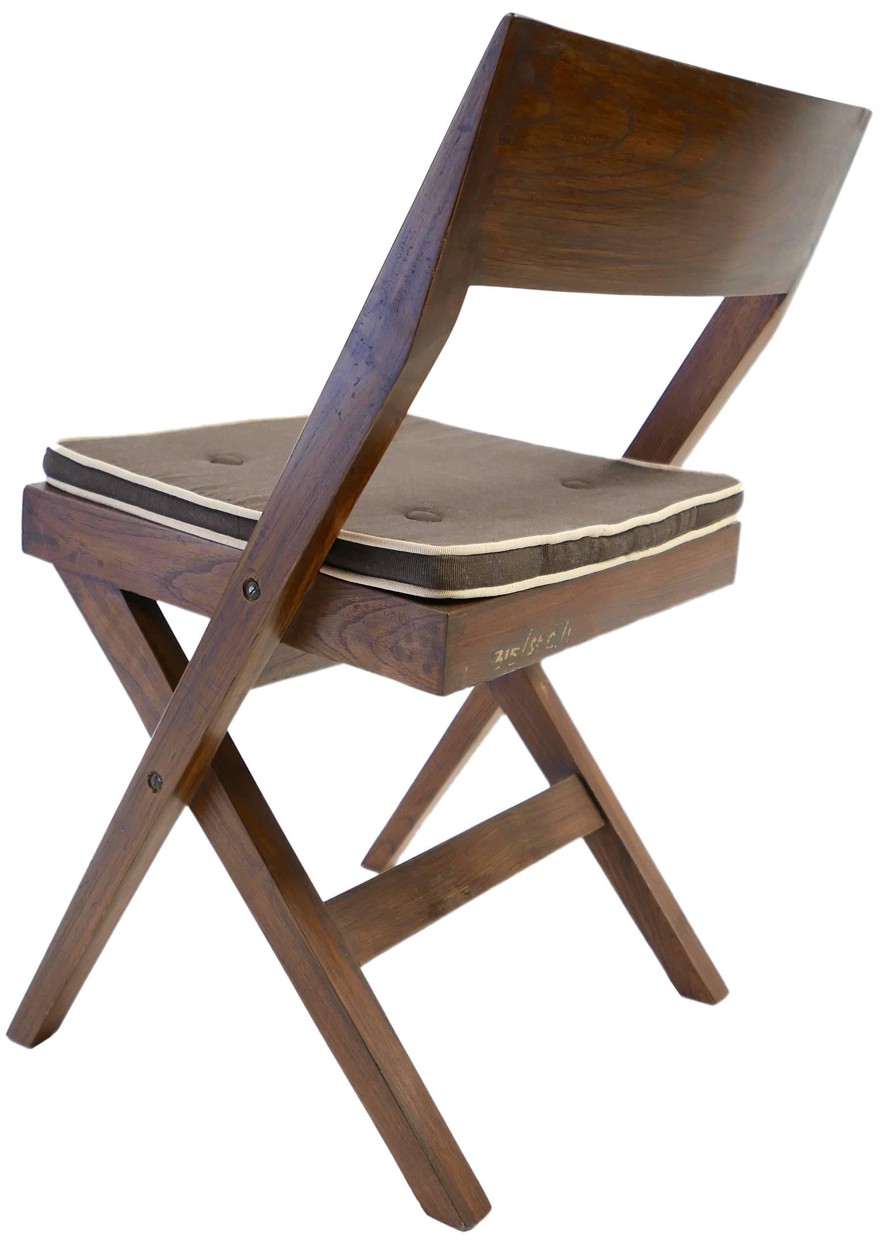 A stunning very well matched set of 10 PJ-SI-51-A Library or dining chairs designed by Pierre Jeanneret for the University Library in Chandigarh India.

Solid teak , hand-made construction.

A few still with the painted stencil or hand applied