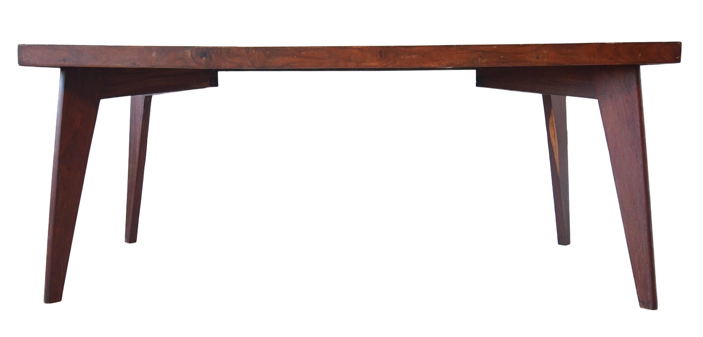A very special early example of the dining table designed by Pierre Jeanneret for the Chandigarh Project. 

This is model: PJ-TA-01-A.
Categorized as a dining table. 

This table is made from solid Sissoo rosewood with a stunning cathedral