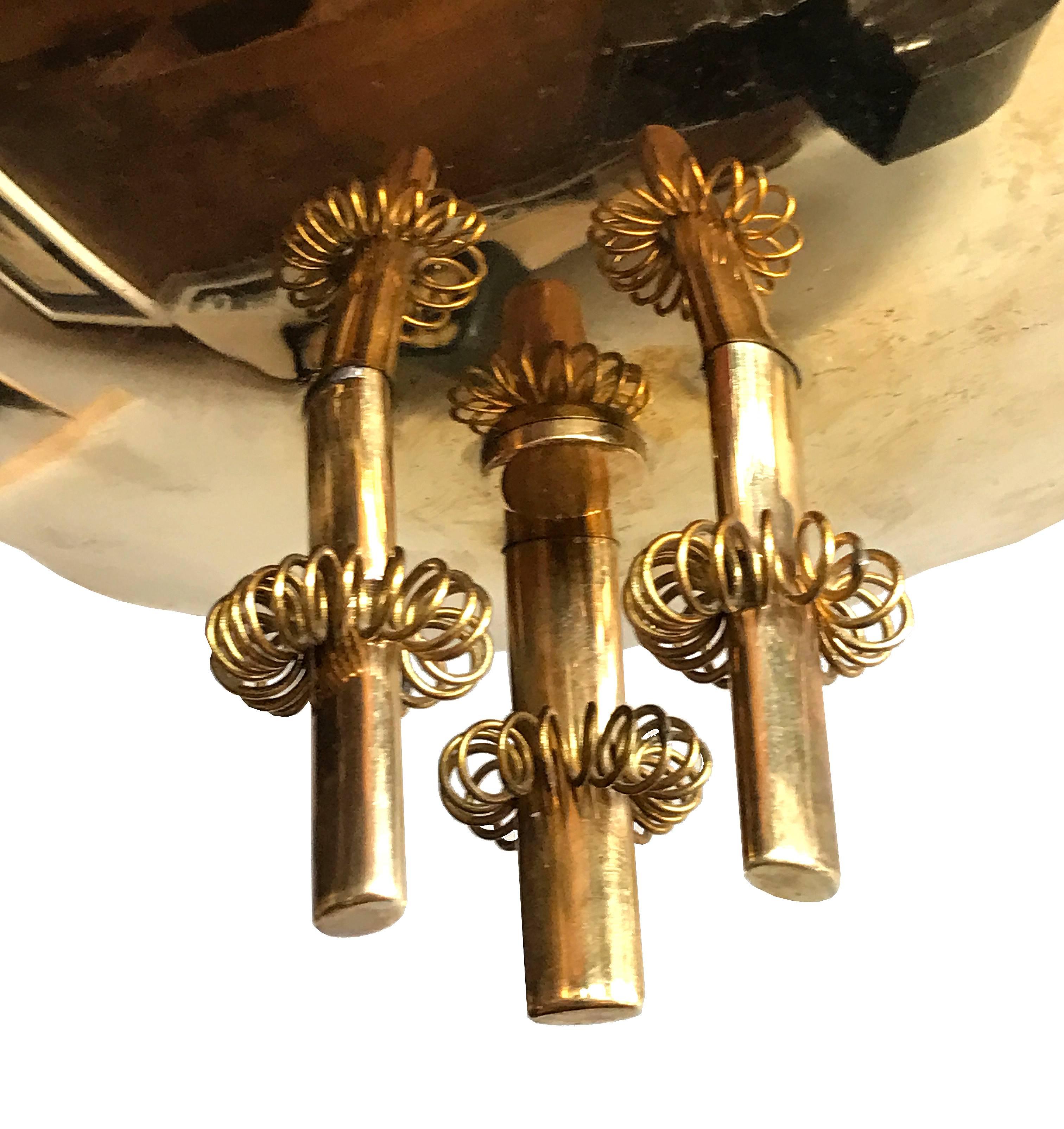 A beautiful, lyrical Paavo Tynell Chandelier in Solid brass for Taito Oy, circa 1950.

This is a terrific example of the Iconic lamp by the Scandinavian Master. 

Original glass shades and leaves. 

Stamped to body 9029/3 and TAITO OY TT

A