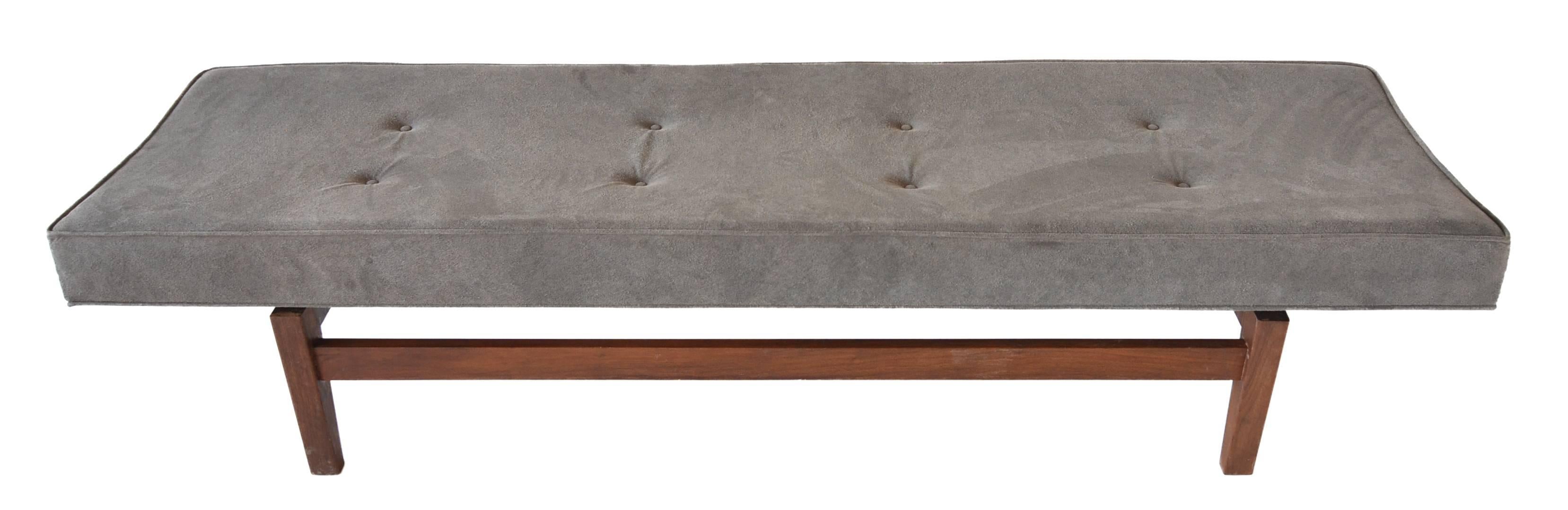 A terrific 6' long bench by Danish American designer Jens Risom. 

A great form with a curved bench seat sitting on a solid walnut floating base. 

Recently reupholstered in beautiful suede.

 