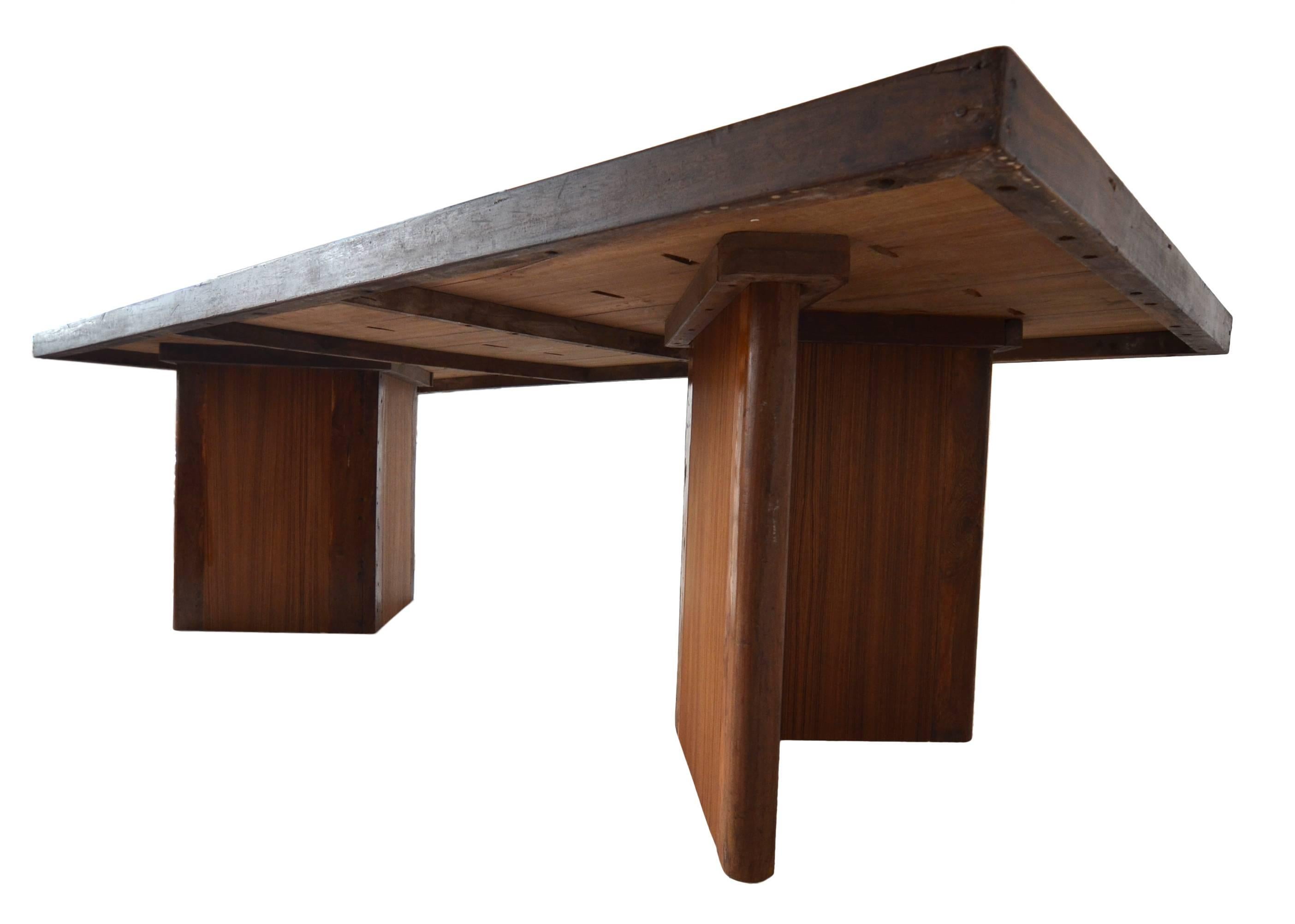 An incredible example of a very rare large library table by Pierre Jeanneret for the Chandigarh Project, circa 1955.

This example is in teak. An incredible solid book matched teak top with solid and veneered teak legs.
One of the best correct