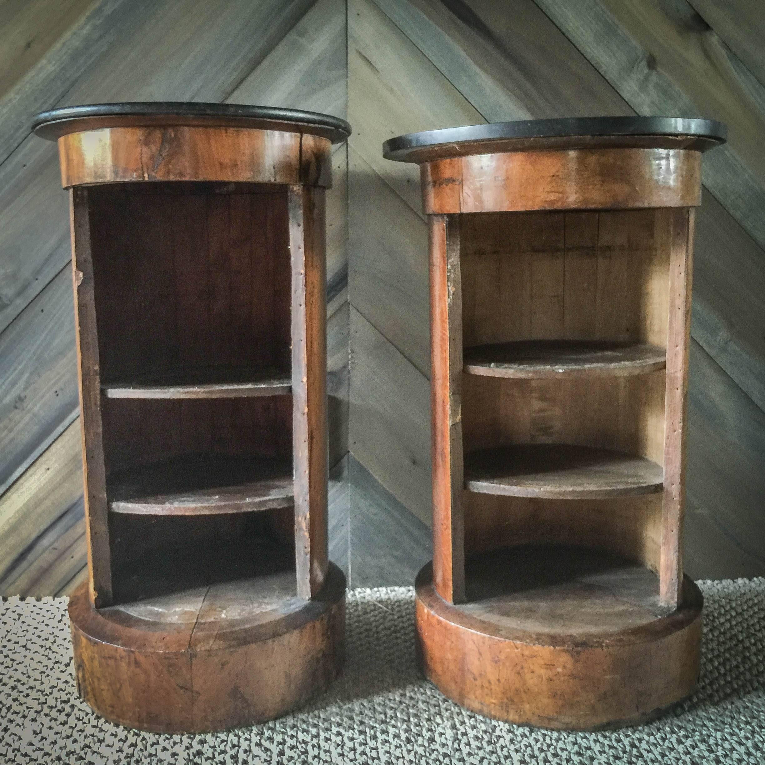 These cabinets are not an exact pair but work well together and were bought from the same estate and presumably used together. One is one inch shorter with a slightly thicker detached black marble top. Both have two shelves in the back without the