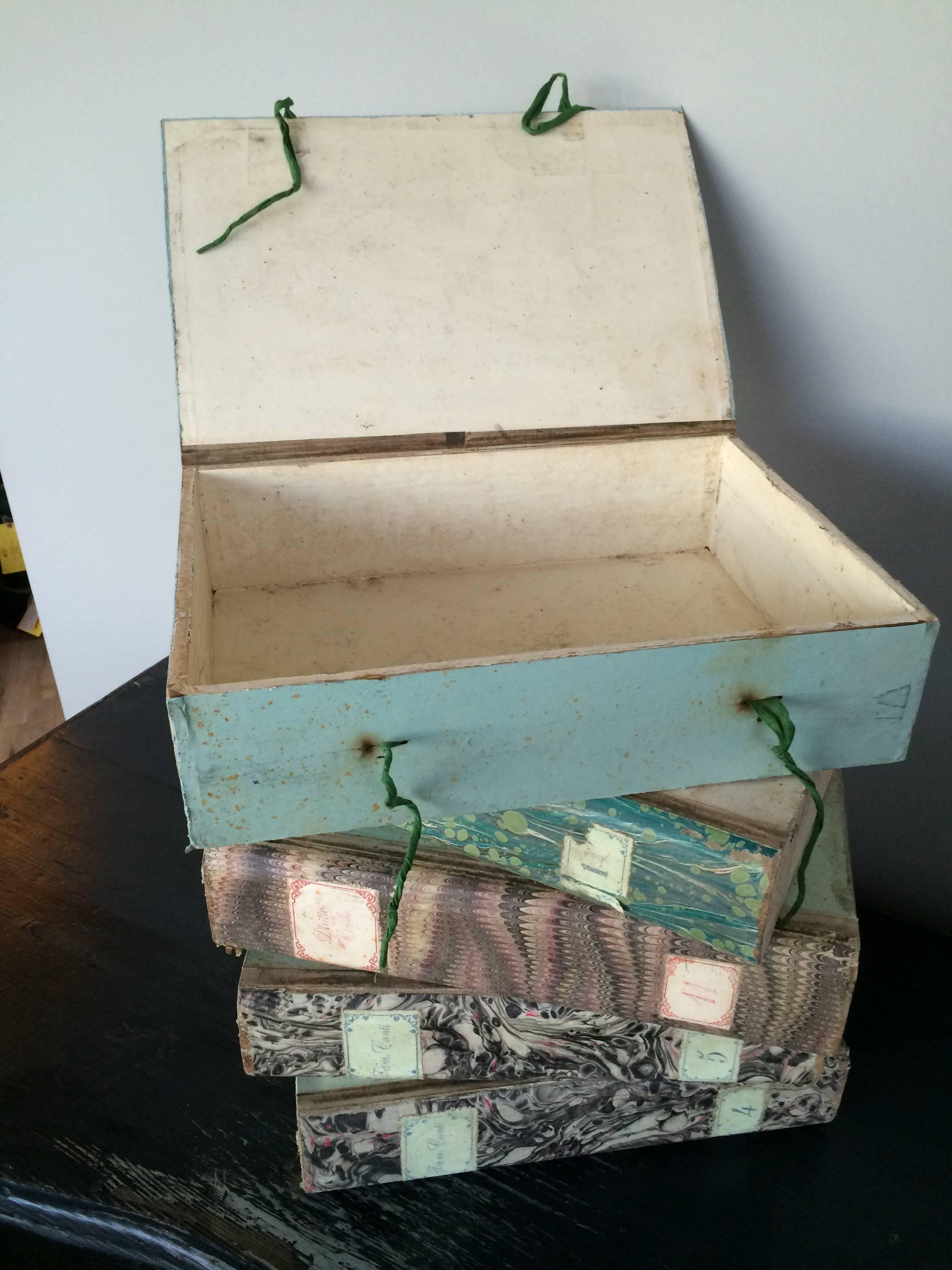 Italian document boxes in colorful marbled paper on board with tie ribbons, used by families to organize family documents. From Bologna, Italy, circa 1920. 10 boxes available. Price is per box.