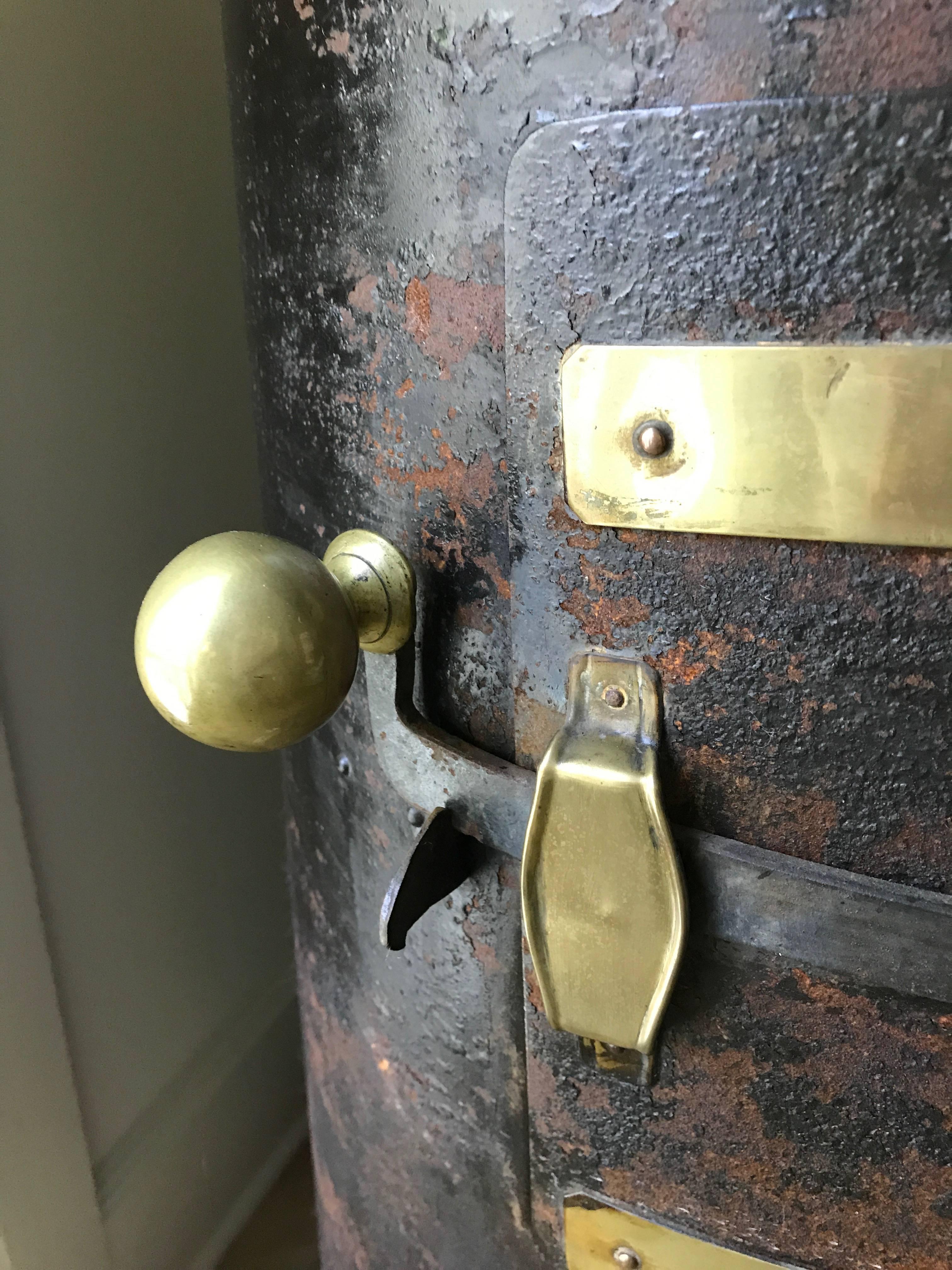 Iron and brass stove from the mid-19th century with beautiful handles and accents.