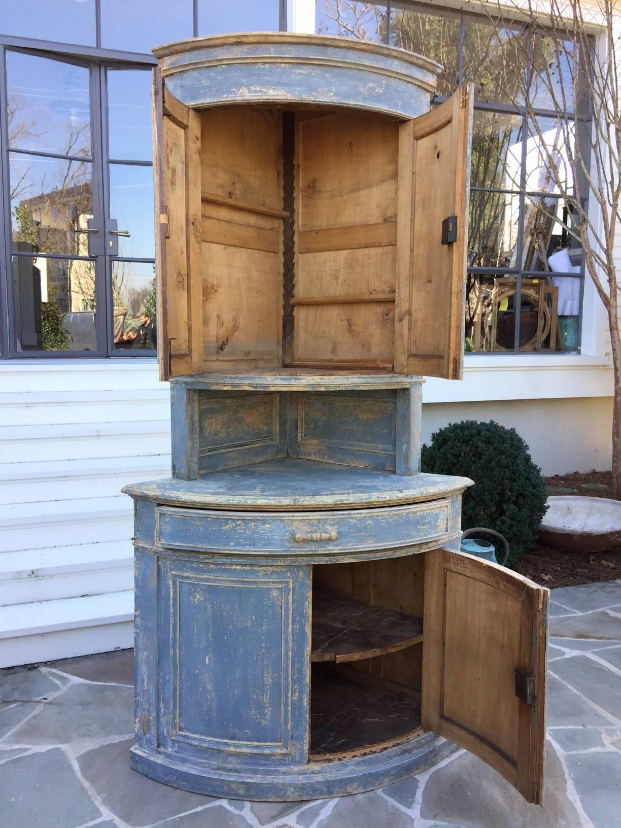 Swedish blue bow front corner cupboard, circa 1890. Original carved handles and original paint.