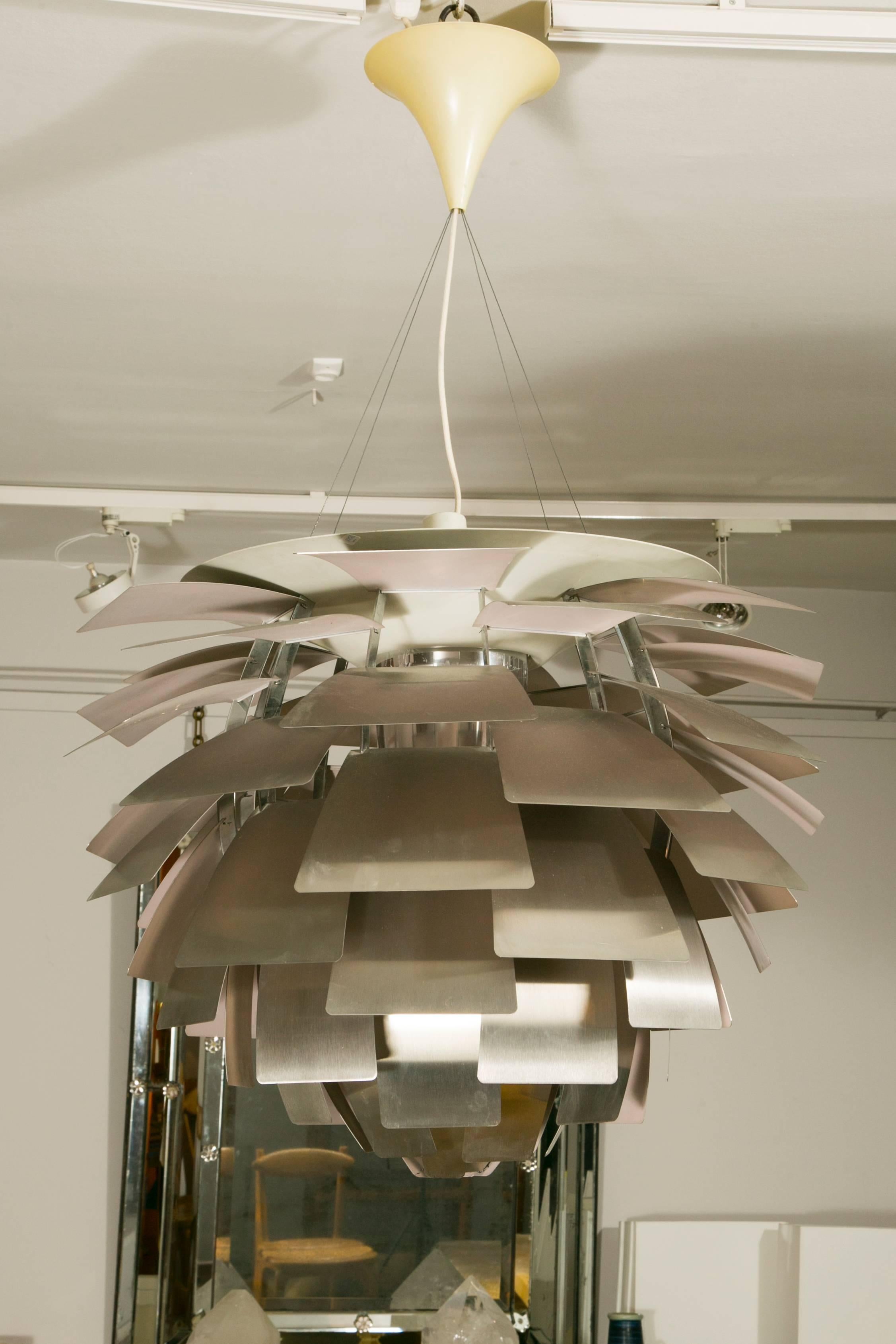 A brushed metal 'Artichoke' ceiling fixture.
Designer: Poul Henningsen.
Manufacturer: Louis Poulsen.
Denmark, 1958.

This is the largest size of the 